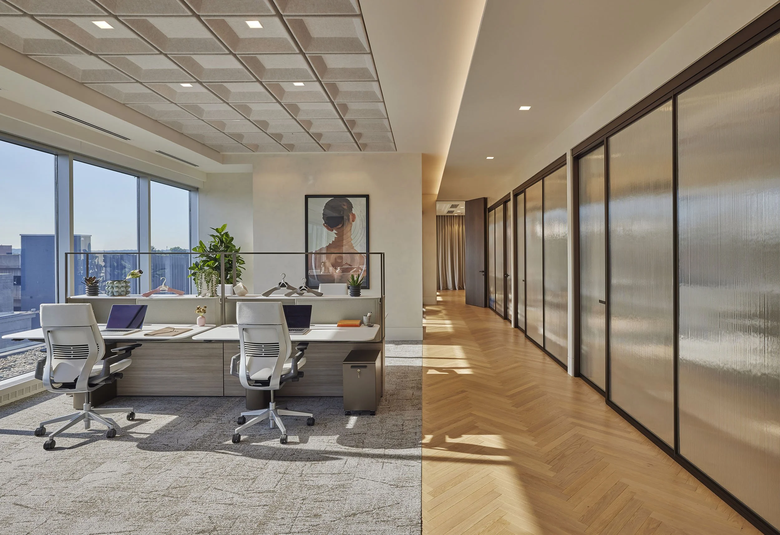 Main open studio, chevron wood floors, ribbed glass partitions