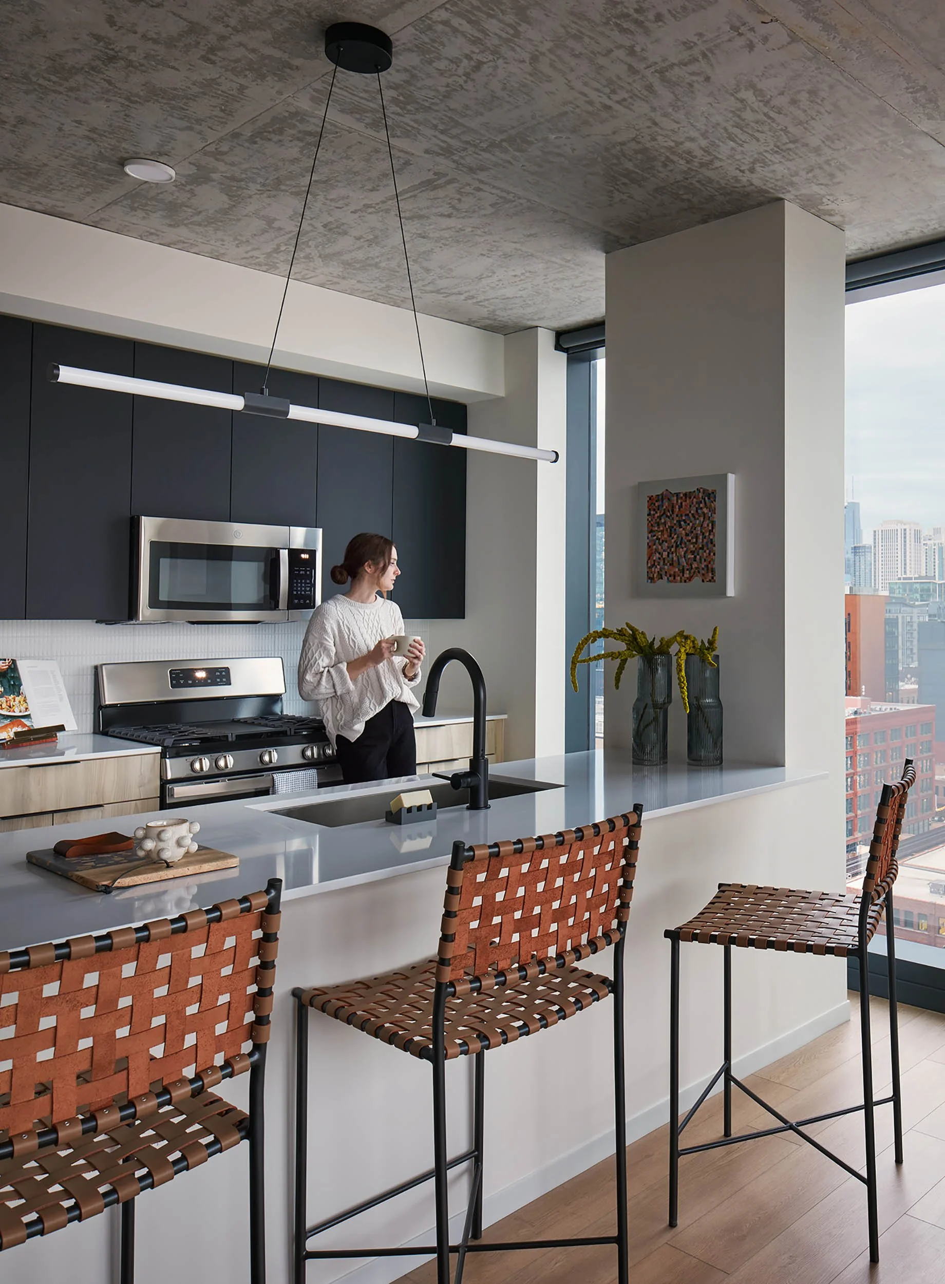 Resident kitchen with exposed concrete ceiling
