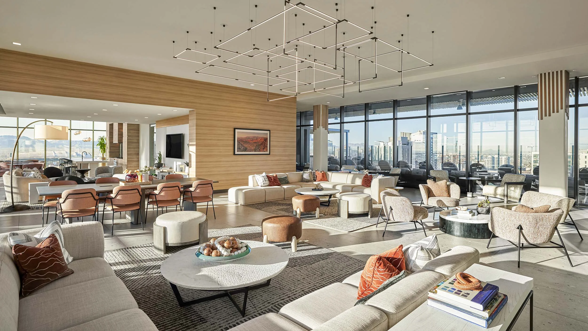 Multifamily lounge with stick bulb chandelier