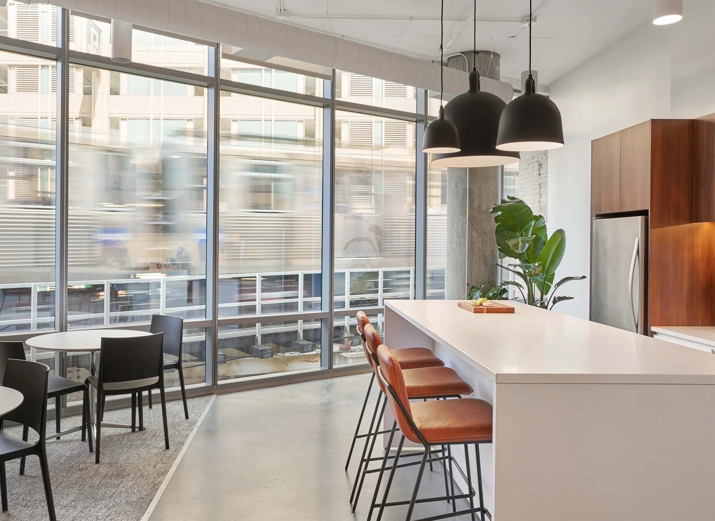 White and Oak hospitality kitchen with black pendants