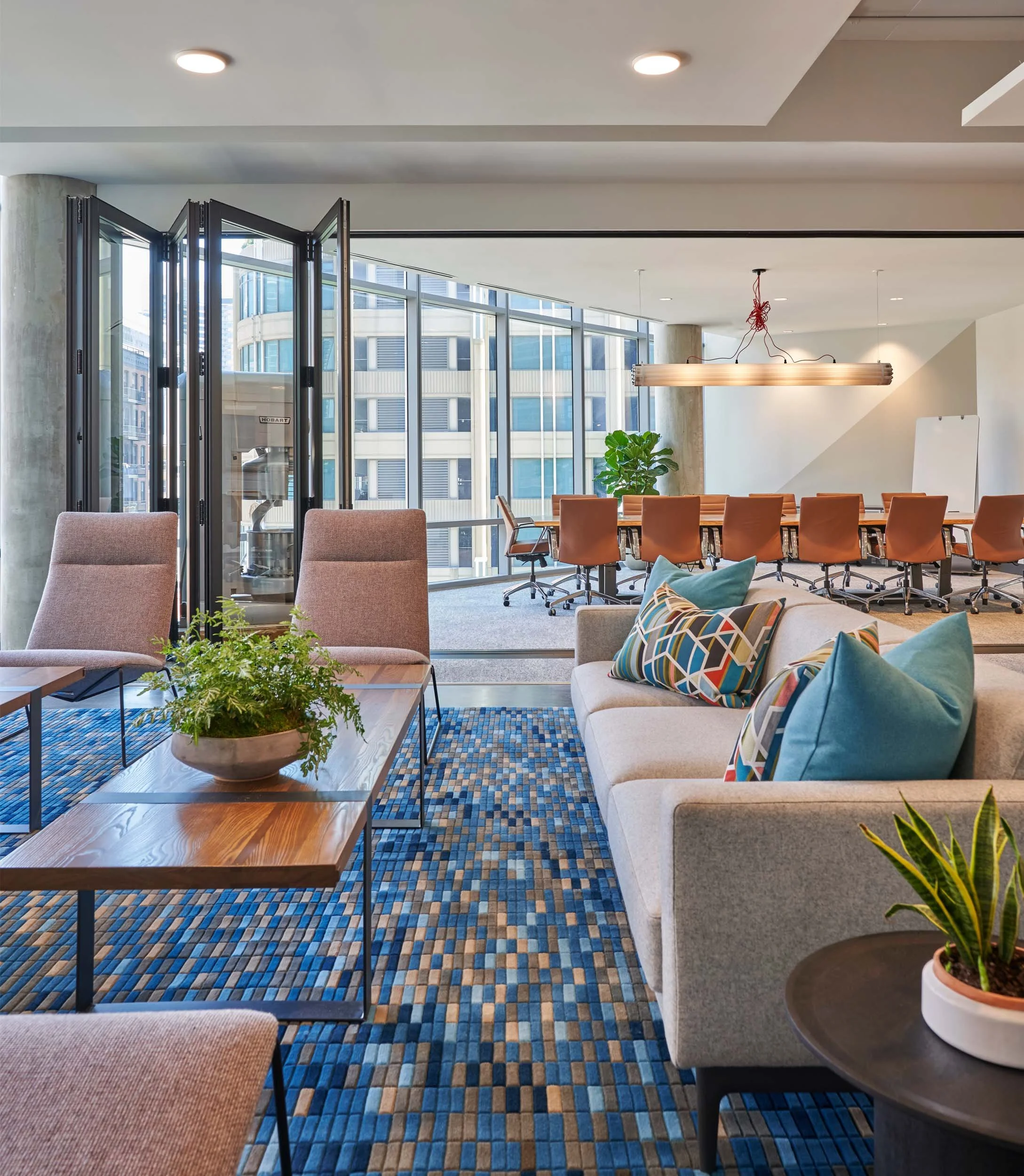 Steel and old growth wood coffee table, conference lounge, expandable conference room with retractable doors.