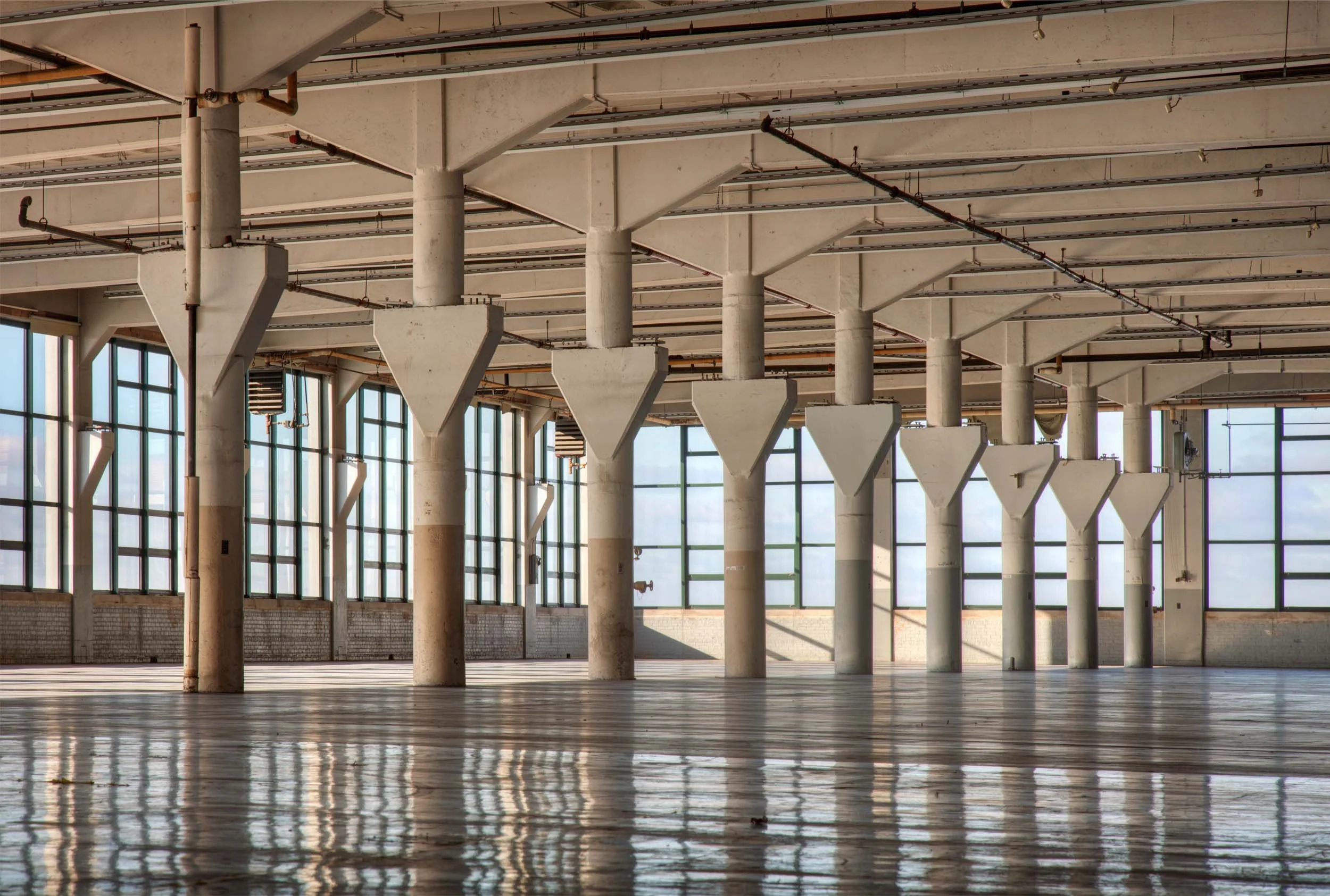 Vast empty warehouse space, artistic architectural photography