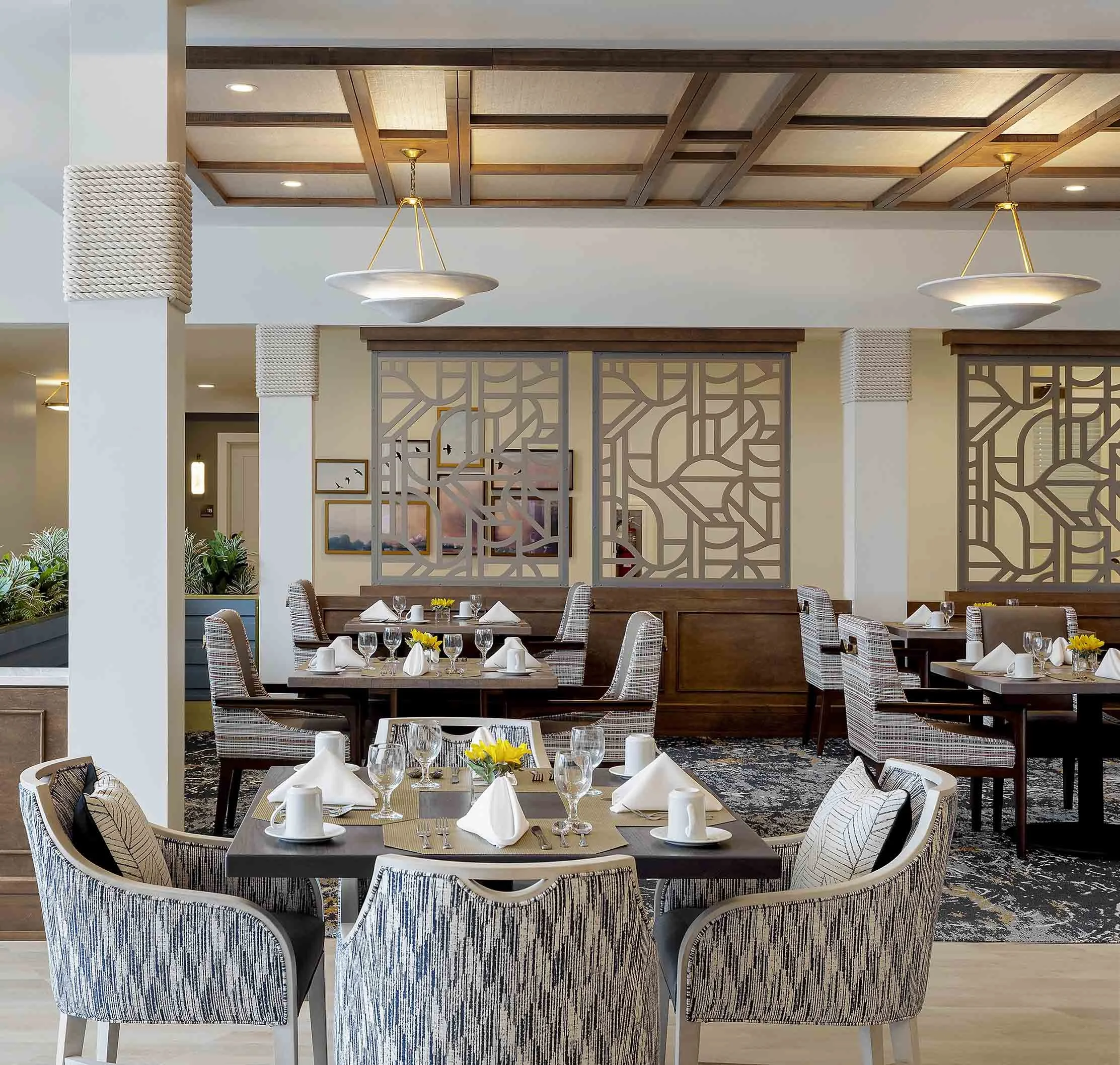 Assisted living dining room, elegant lighting, decorative screens, rope wrapped columns