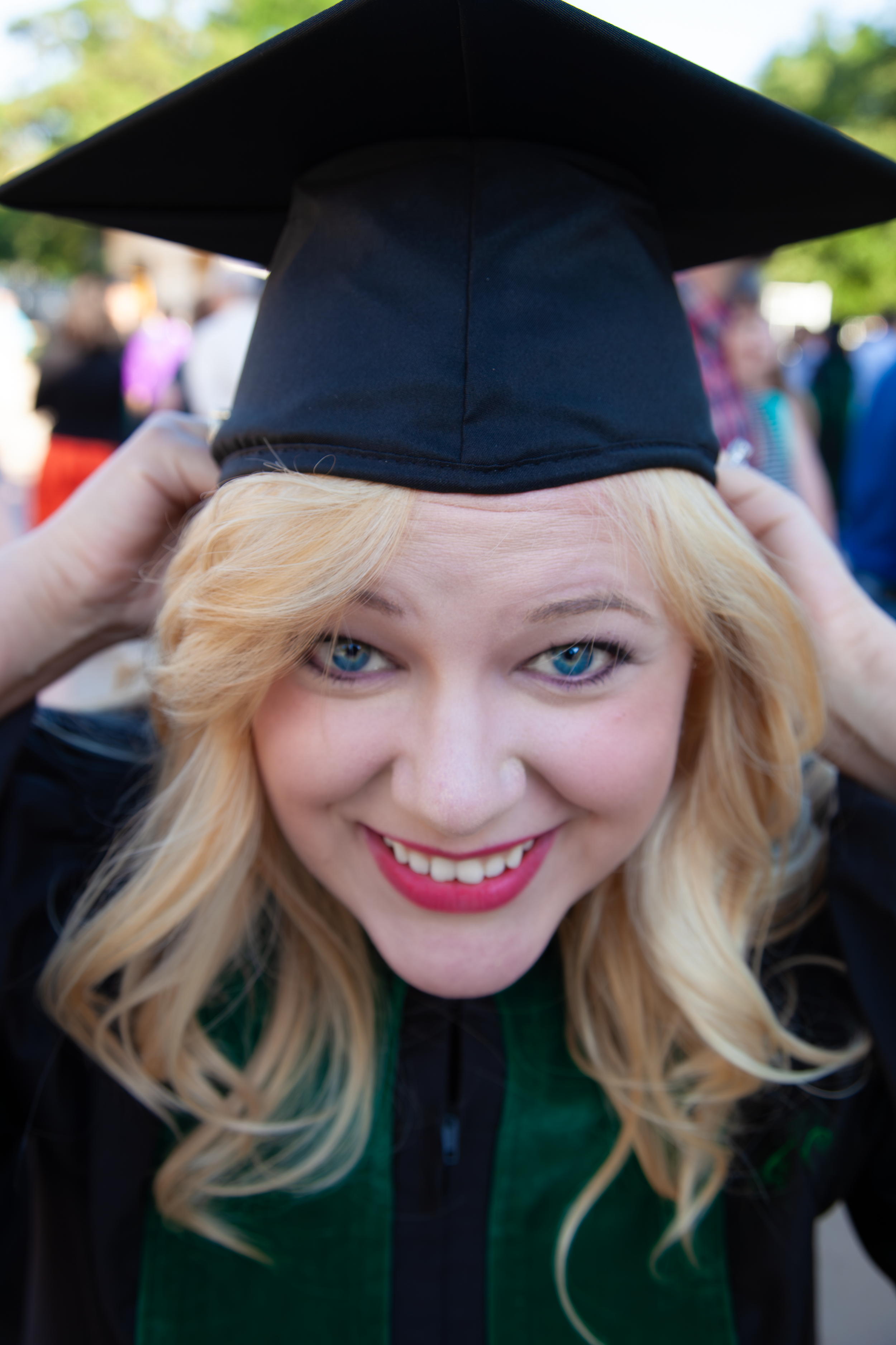 Beautiful young lady in graduation cap