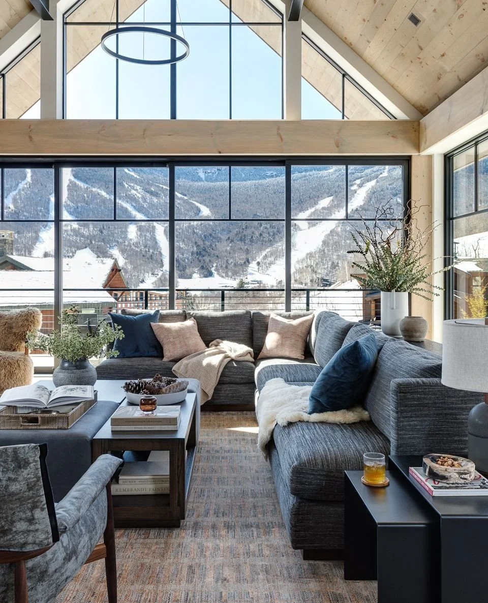 The living room of our Spruce Modern project was designed to give the homeowners the best view possible. The entire home faces the &ldquo;chin&rdquo; of Mount Mansfield, Vermont&rsquo;s highest peak, with primary living spaces placed upstairs to make