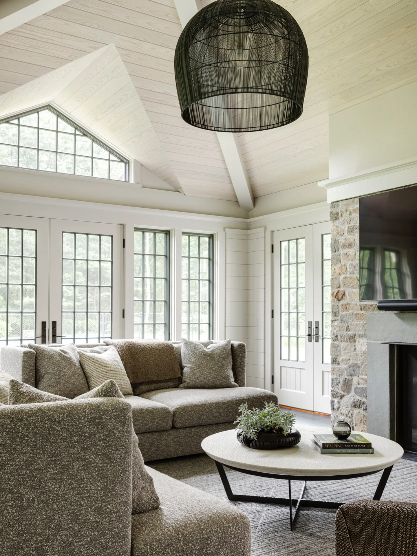 Expansive ceilings add drama to this classic home and an oversized pendant adds balance here. The grand windows harvest the natural light, connecting this space to the outdoors for a grounded feel. #KennerknechtDesignGroup⁠
⁠
#livingroomdesign #livin