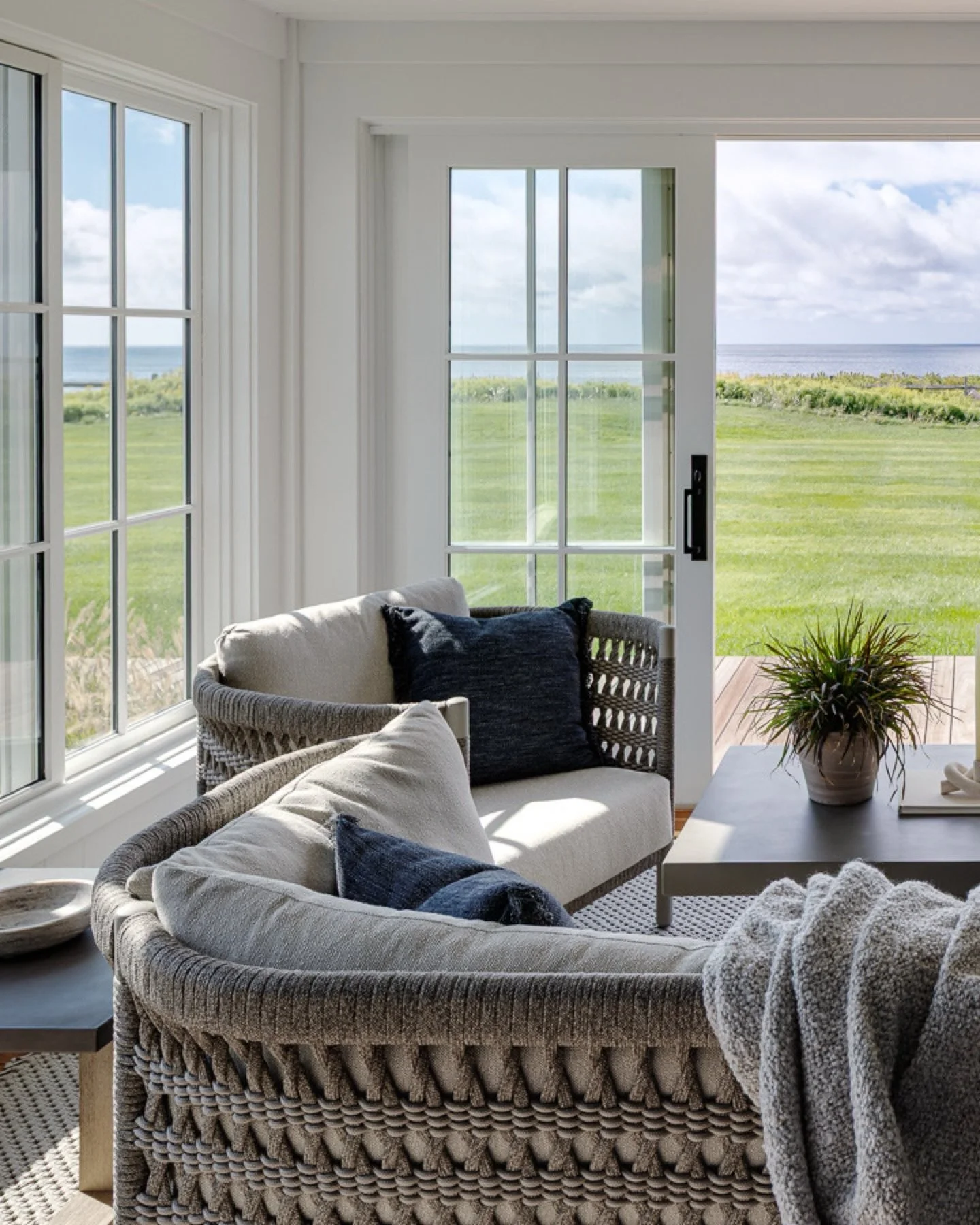 Morning coffee served with the sound of surf and salt in the air. This gentley curved sofa from @janusetcie creates the perfect alcove to take in the coastal views. #KennerknechtDesignGroup⁠
⁠
#livingroomdesign #livingroom #interiordesign #beachhouse