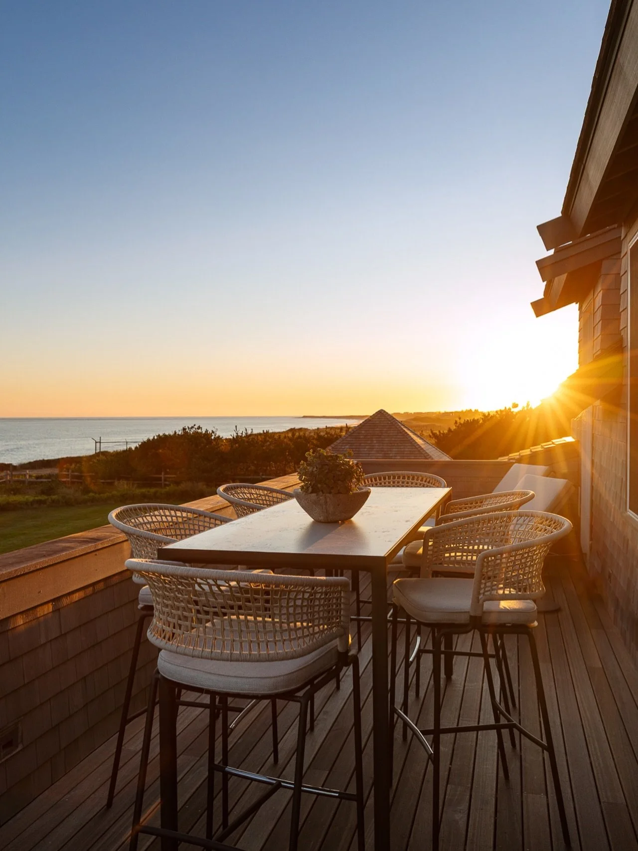 The overlook deck at our Oceans Edge is the perfect place to dine al fresco or enjoy a cocktail at sunset. With wood that will endure the salt air and wicker chairs that seamlessly blend with the beach grass and sand, every detail speaks to that Summ