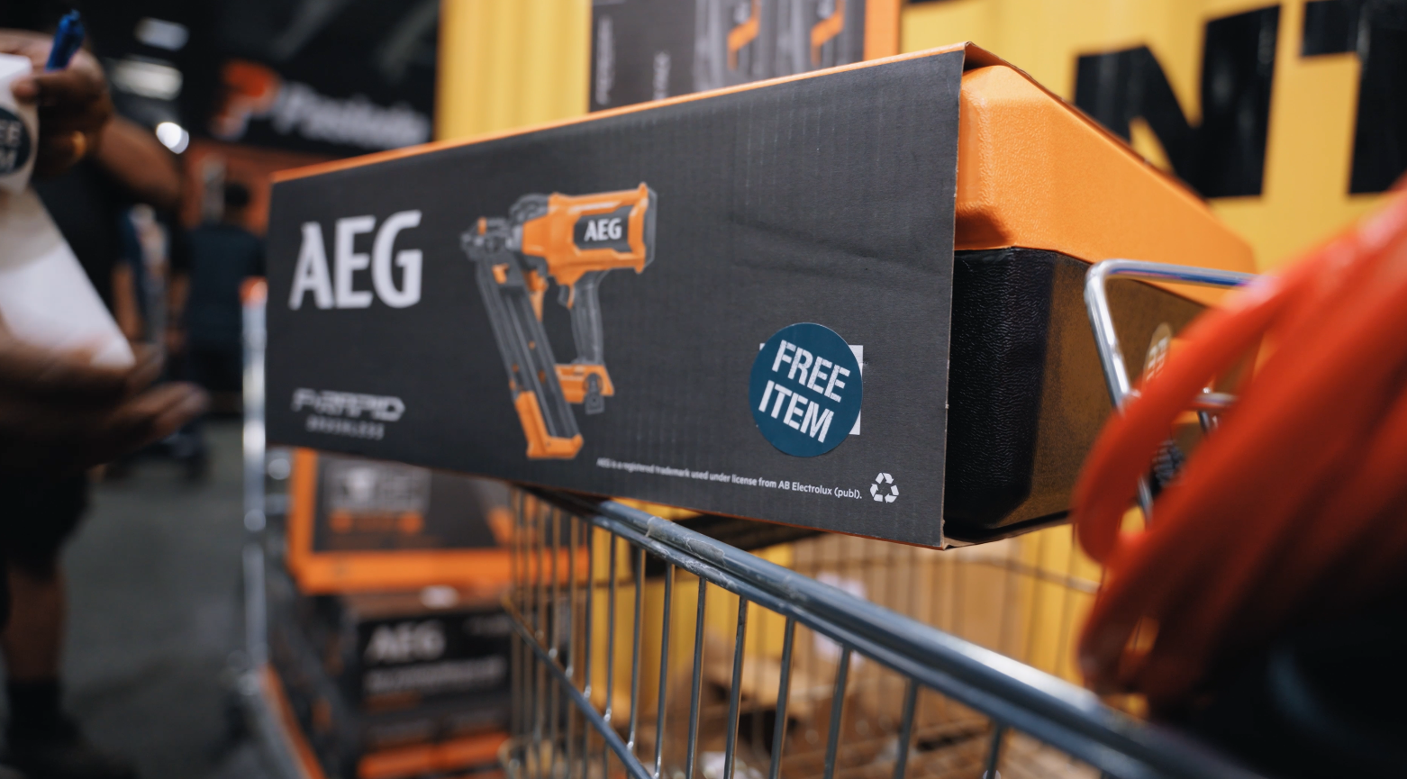 A shopping trolley with an AEG cordless nailer box at the Bunnings Trade Expo