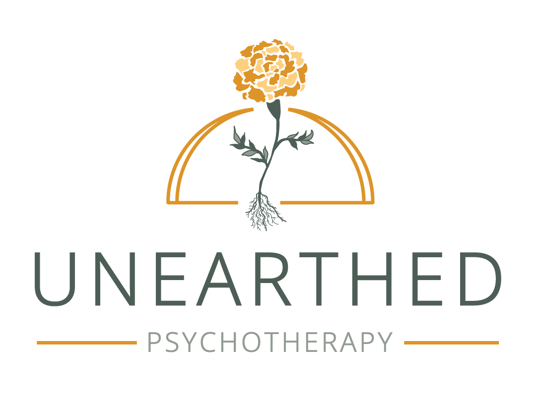Logo for "Unearthed Psychotherapy" featuring orange & green marigold with exposed roots in front of orange semi circle, placed above green business name, with two orange lines on either side of "Psychotherapy."