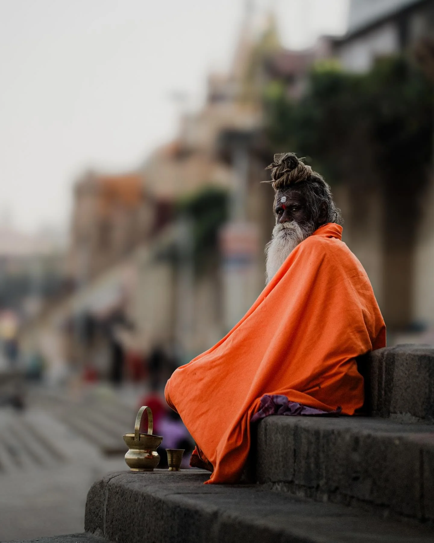 Varanasi is a city that breathes in chants and exhales the scent of incense and river mist. The Ganges glows gold at sunrise, carrying prayers on its rippling back. Steps worn smooth by time lead to sacred waters where life and death embrace like old