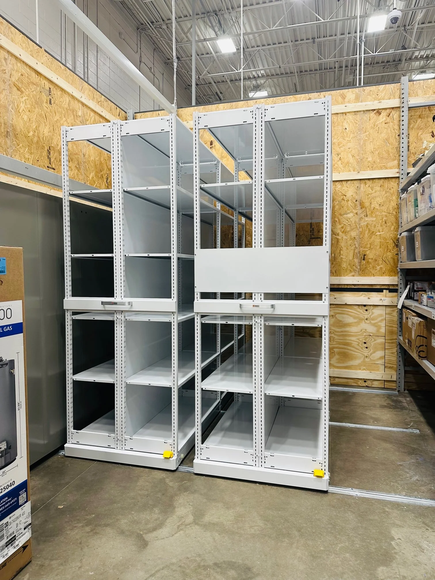 Montel Manual SmartSpace 2M High Density Mobile Aisle Racking Newly Installed Retail Shelving Empty.jpg