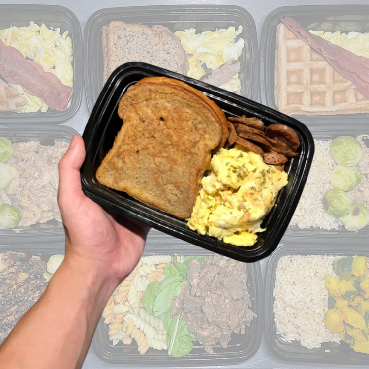 Breakfast meal container with scrambled eggs, toast and sausage slices