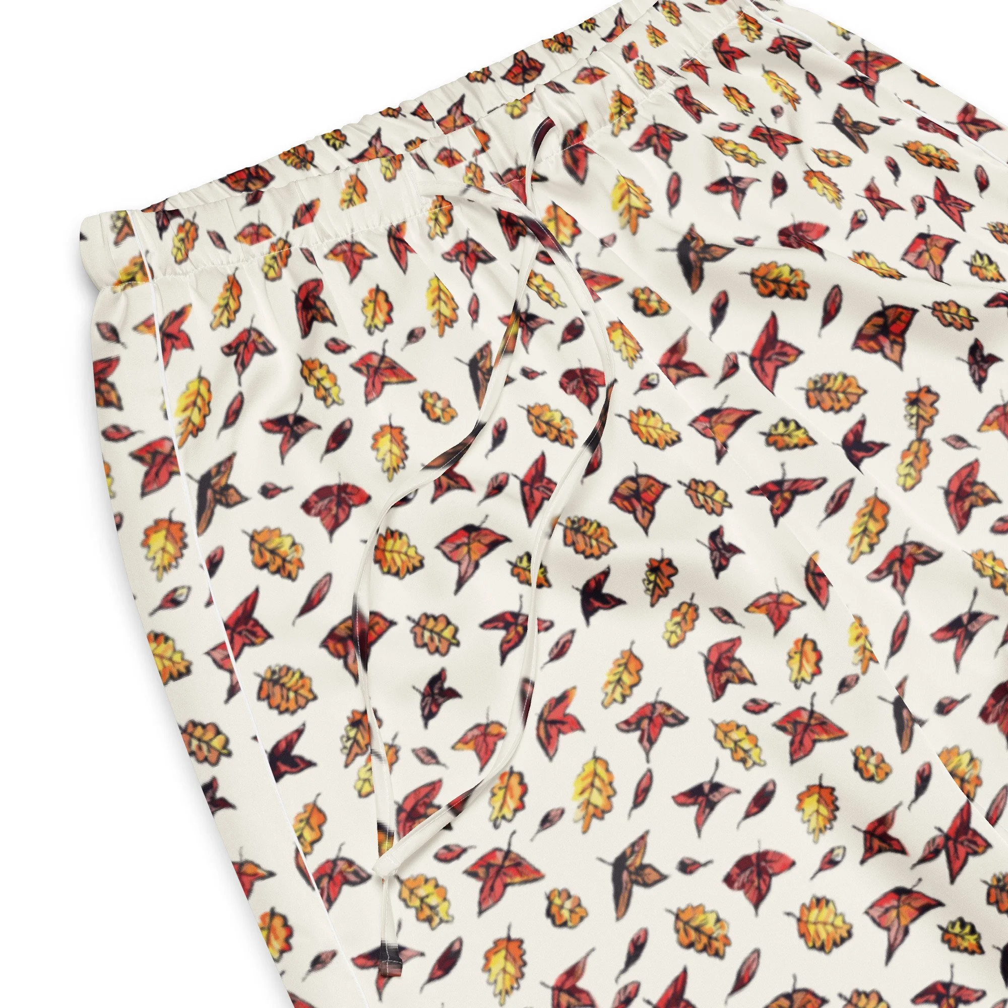 Close-up of the Autumn Frost red, orange and yellow autumn leaf print on cream fabric