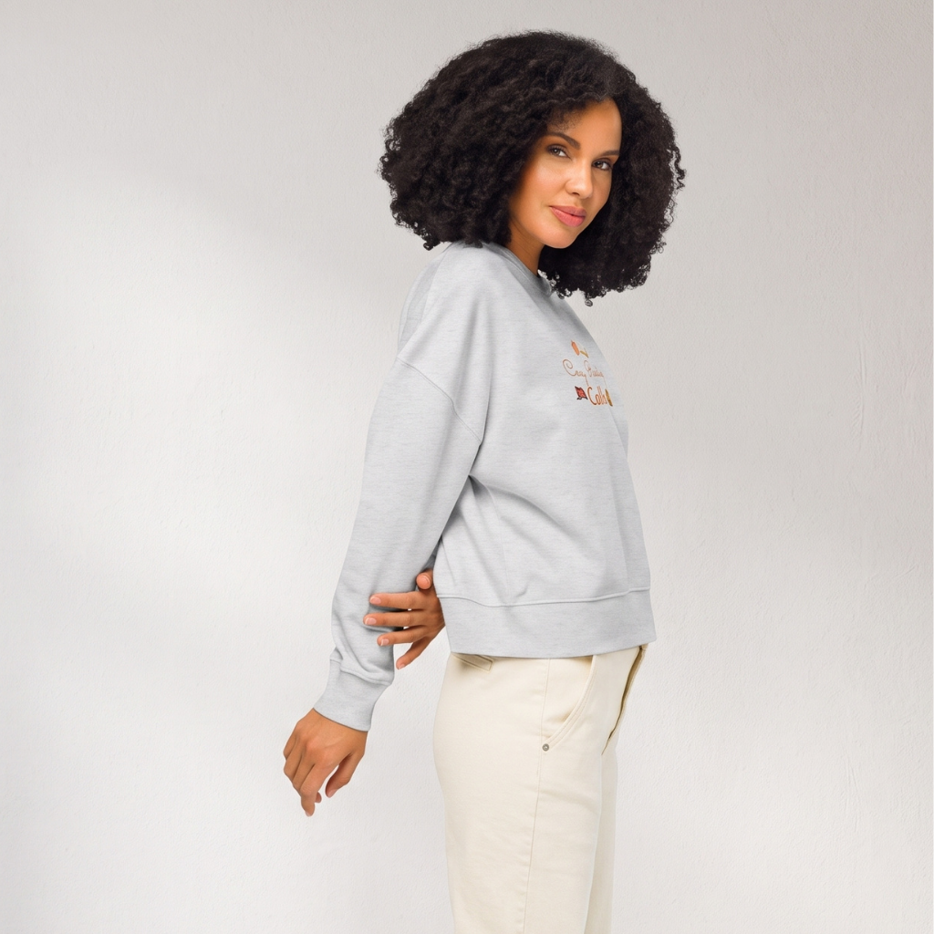 Side view of a woman wearing the heather grey 'Cosy Reading Calls' sweatshirt