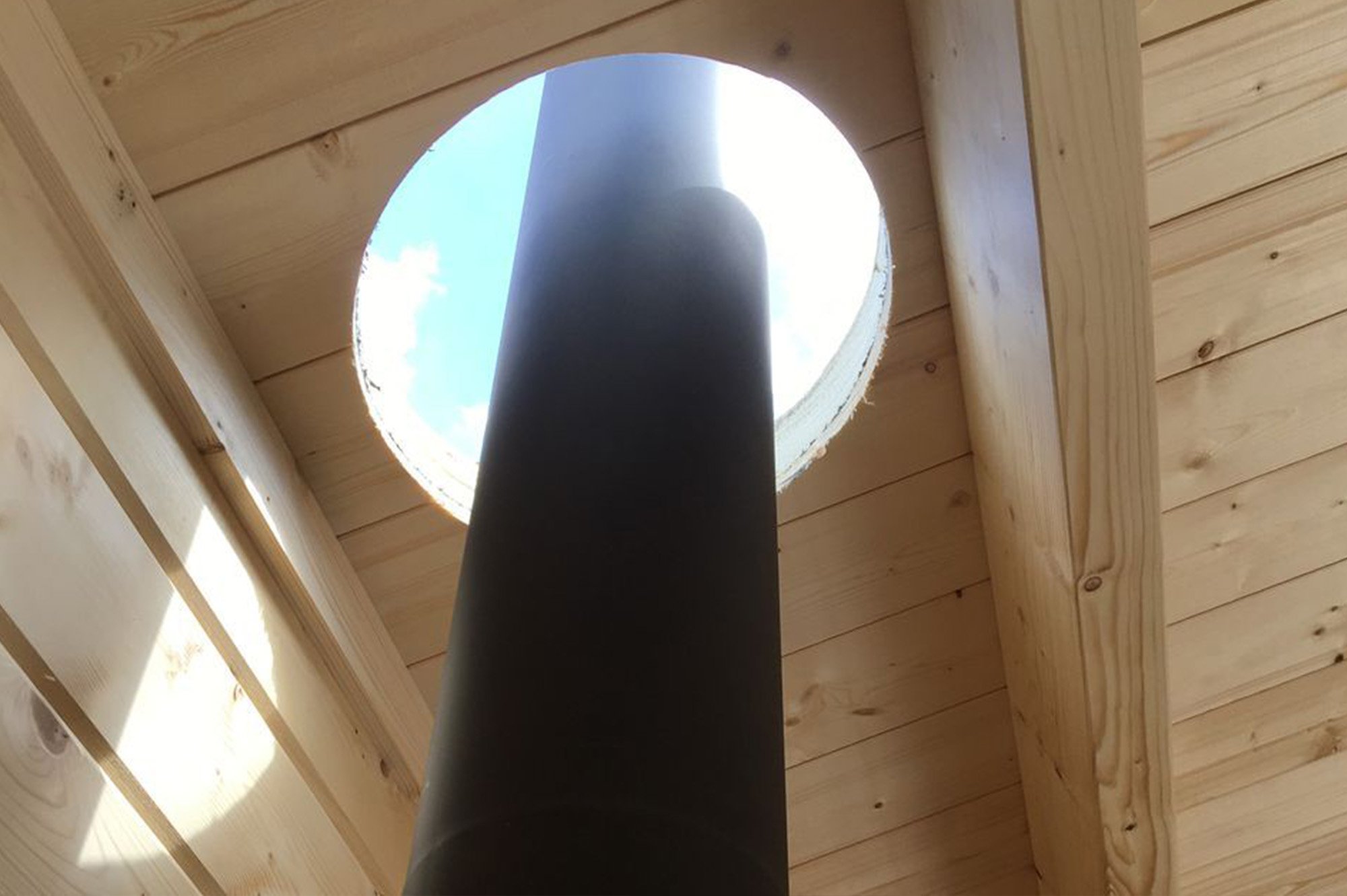A 310mm diameter hole is machined vertically through the roof structure
