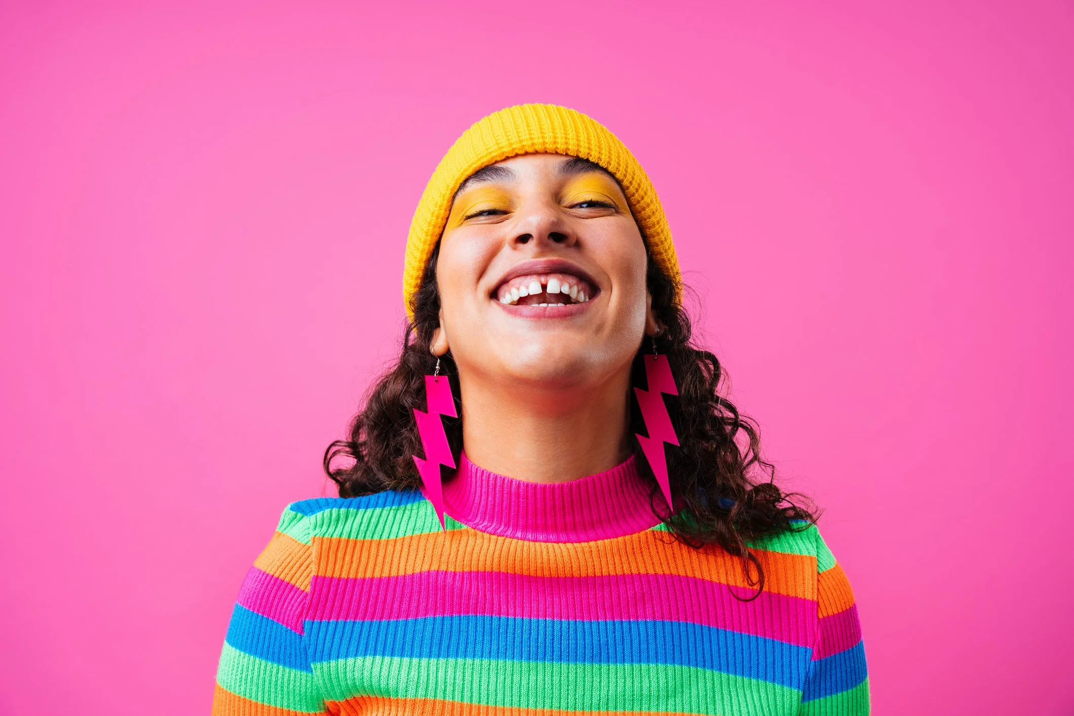 Woman smiling and feeling confident during hypnotherapy support for anxiety and wellbeing