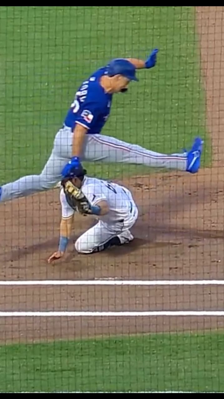Texas Rangers Wyatt Langford with the hurdle to avoid the tag of Rays 1B Jonathan Aranda #mlb #baserunner #baseball #baseballhighlights #rangers #rays