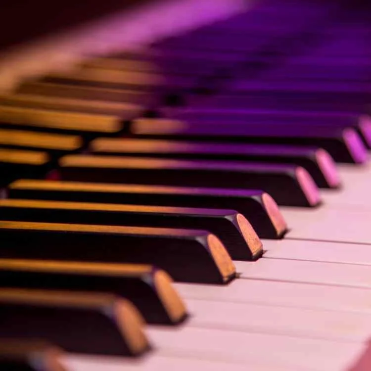 Close-up of piano keys in warm lighting