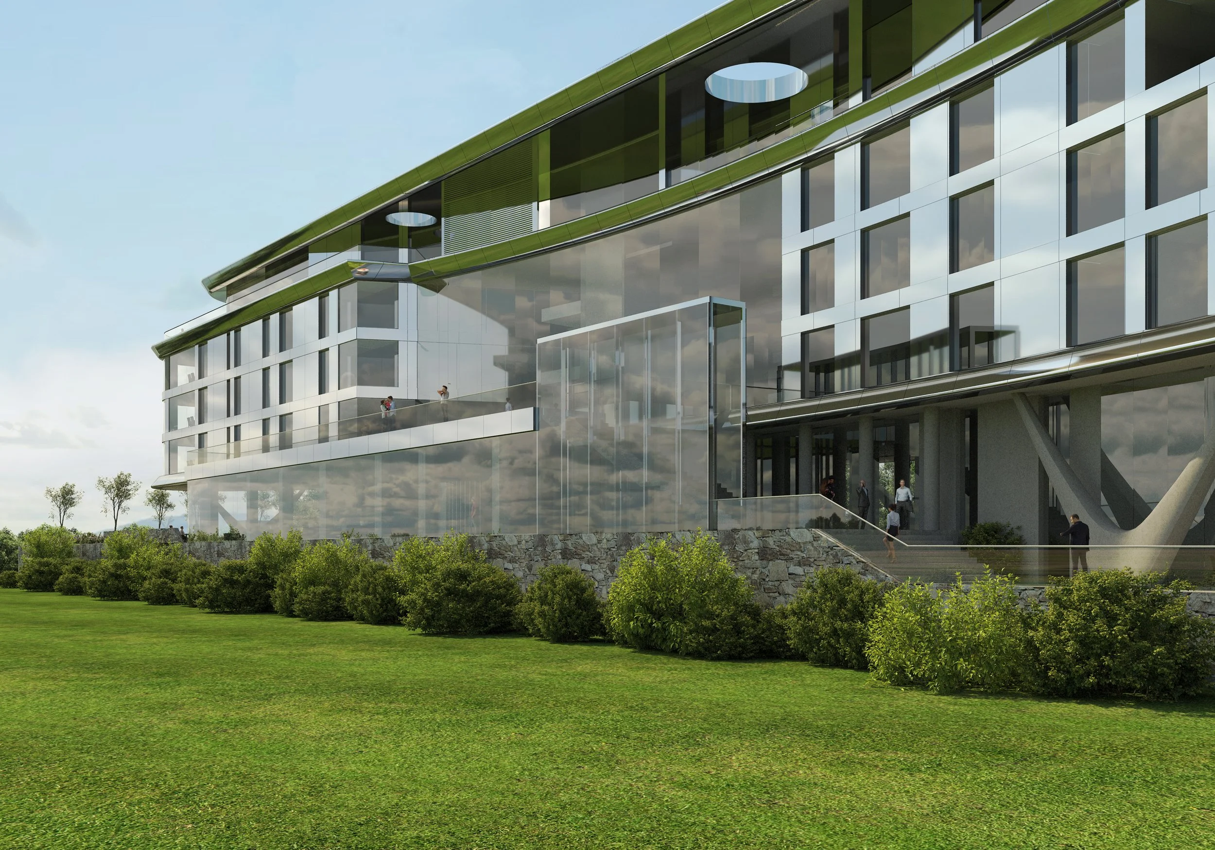 Closer view of the hotel with lawn outside