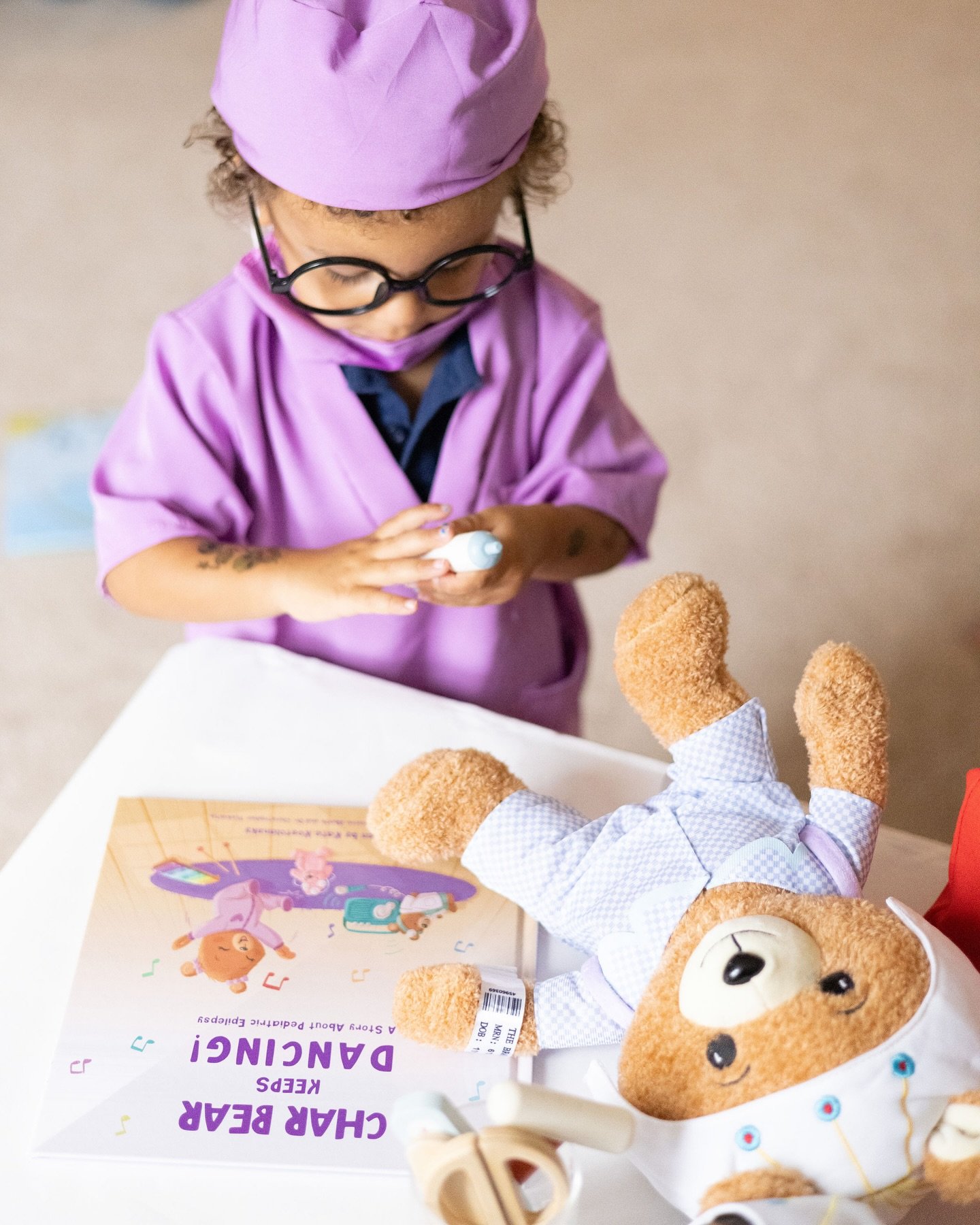 This little brother stole the show in his purple scrubs during our mini photo shoot! 🌟 

Epilepsy affects the whole family and we&rsquo;re working on a bear for super siblings (and friends, neighbors, family, classmates) to include them and introduc