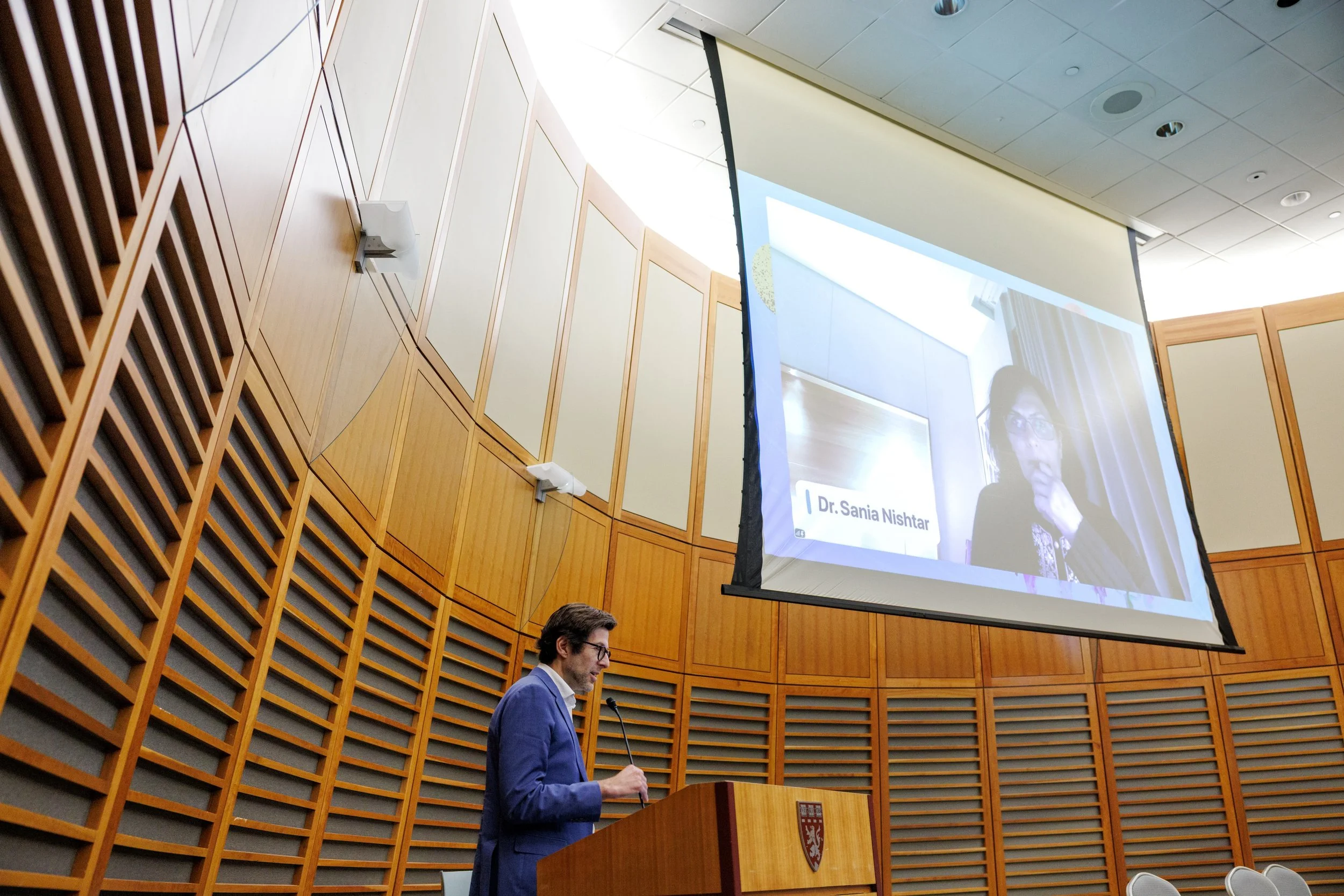 Gene at Podium with Dr. Nishtar.jpg