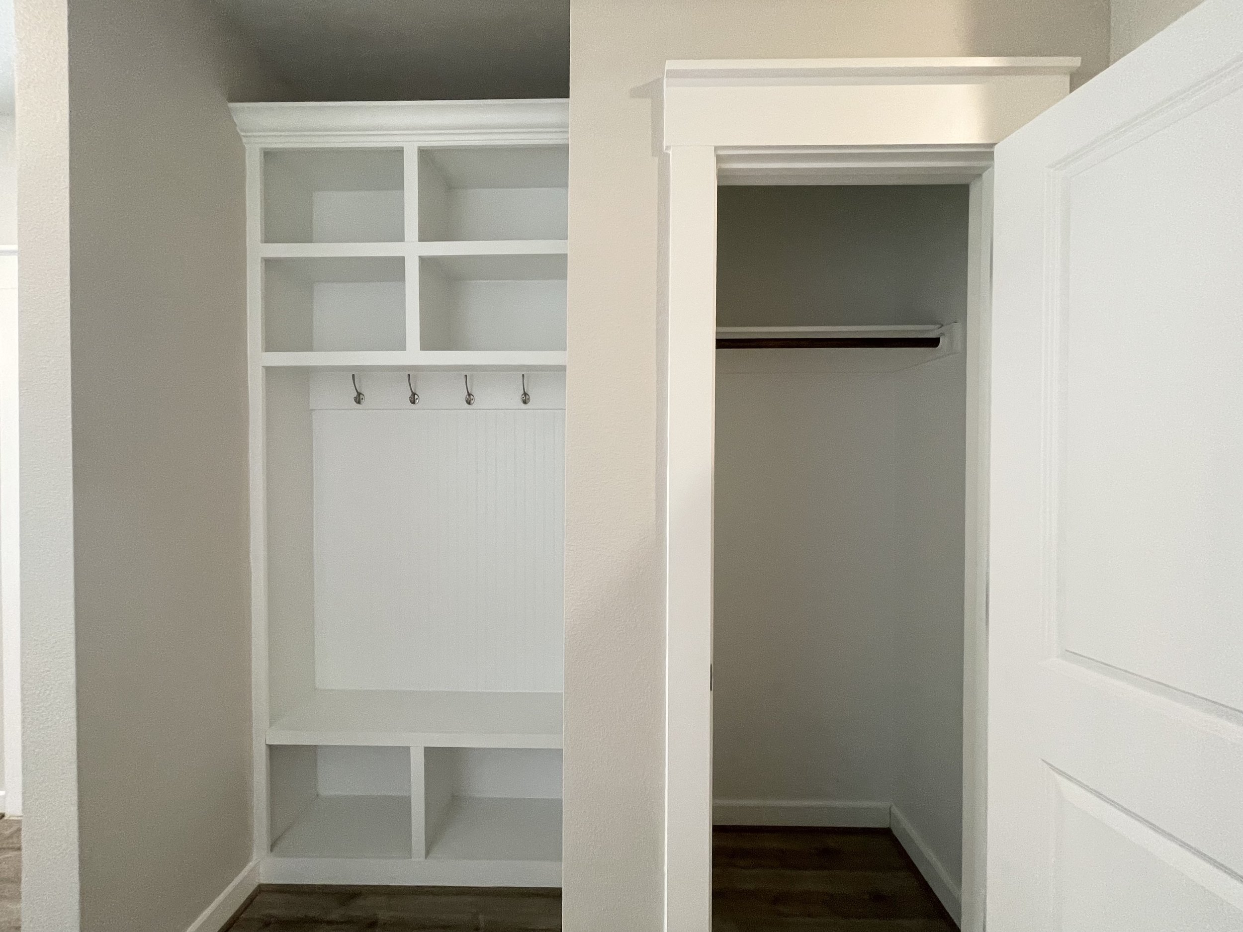 Backpack rack and coat closet downstairs