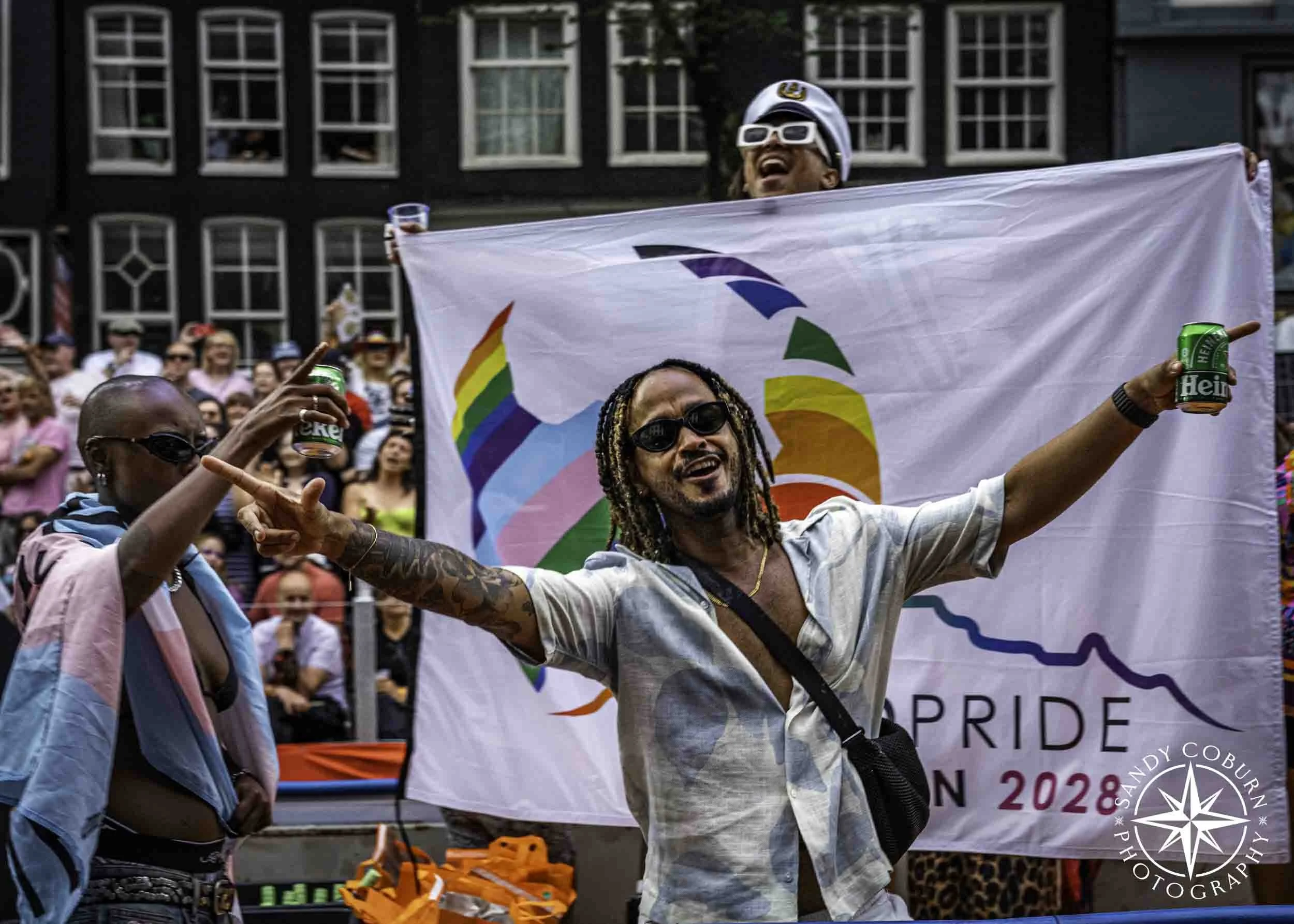 Participants celebrate the next World Pride to be held in Cape Town South Africa in 2028 at the 2026 WorldPride Amsterdam Canal Parade