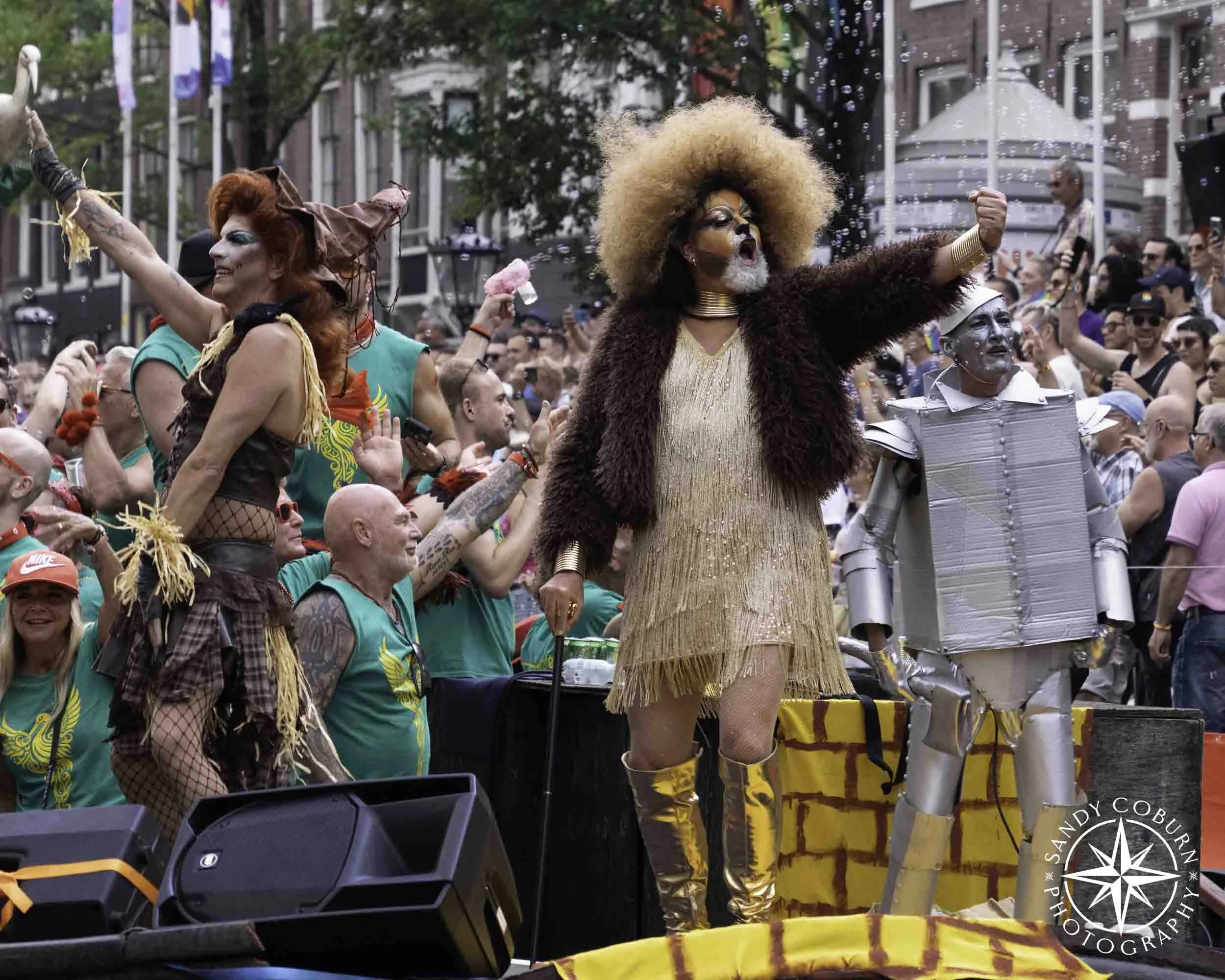 The scarecrow, cowardly lion, and tin man lead a Wizard of Oz themed boat at the 2026 WorldPride Amsterdam Canal Parade