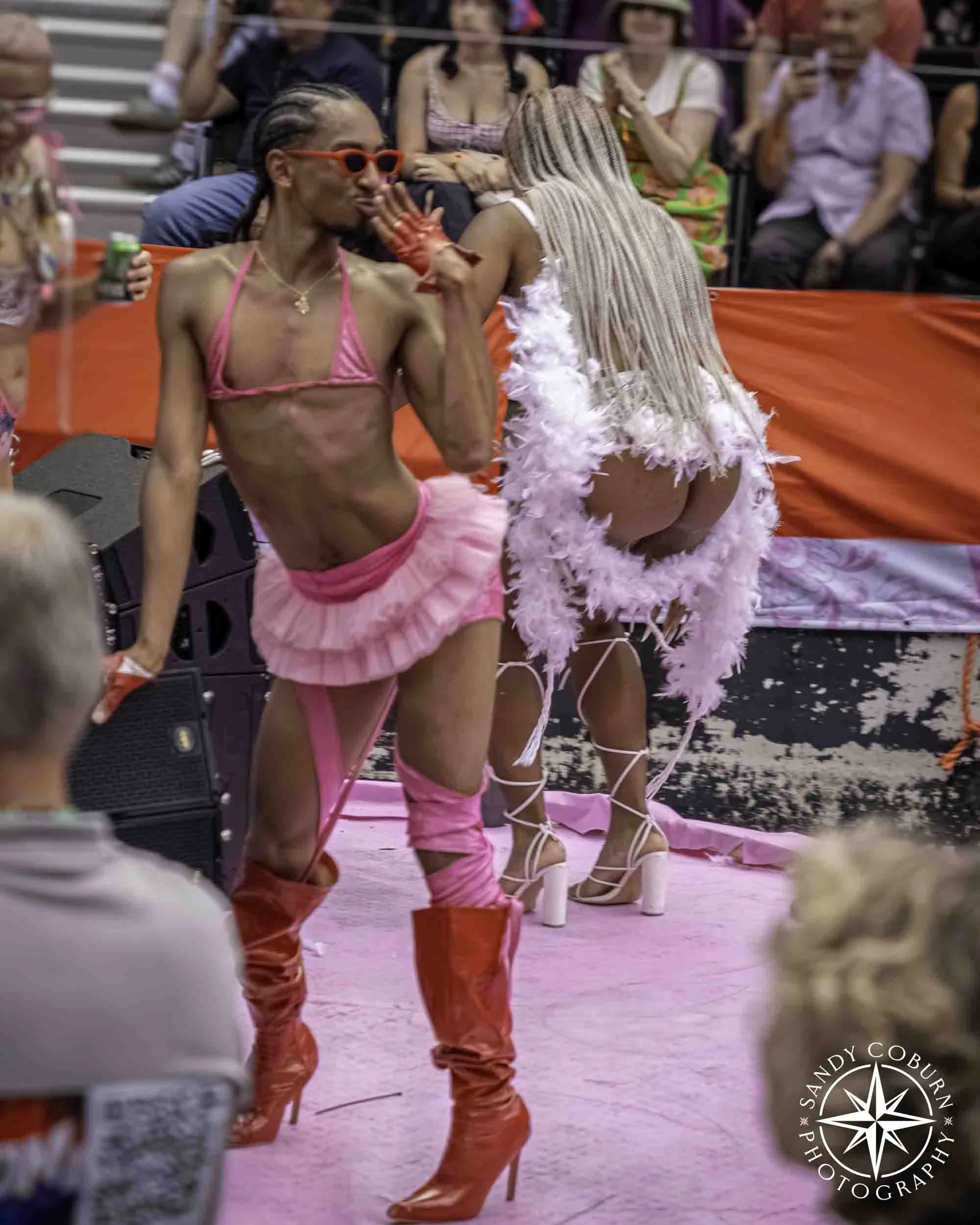 A dancer on a boat poses at the 2026 WorldPride Amsterdam Canal Parade