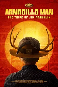 Movie poster for 'Armadillo Man: The Traps of Jim Franklin' featuring a person in a cowboy hat with antlers, facing away, against a sunset background.