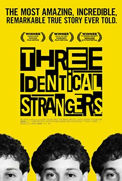 Yellow poster with black text promoting the documentary 'Three Identical Strangers'. It features three black-and-white photographs of smiling young men and highlights award nominations and reviews.