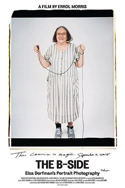 A movie poster for 'The B-Side' featuring Elsa Dorfman's portrait photography. The poster shows an elderly woman in a hospital gown holding a jump rope, smiling, against a plain white background.