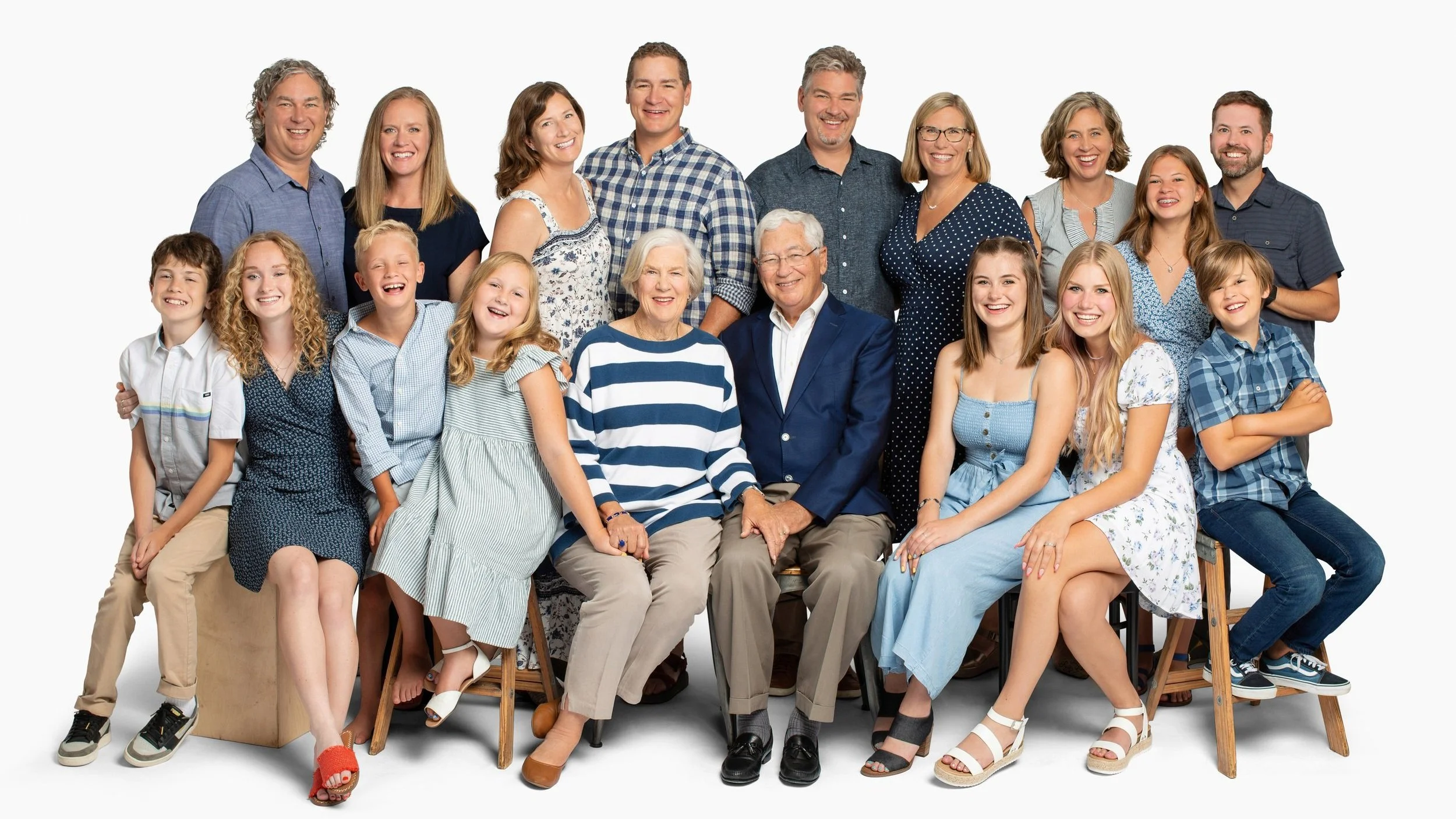 Multigenerational extended family studio portrait featuring grandparents, adult children, and grandchildren by a Seattle family photographer.