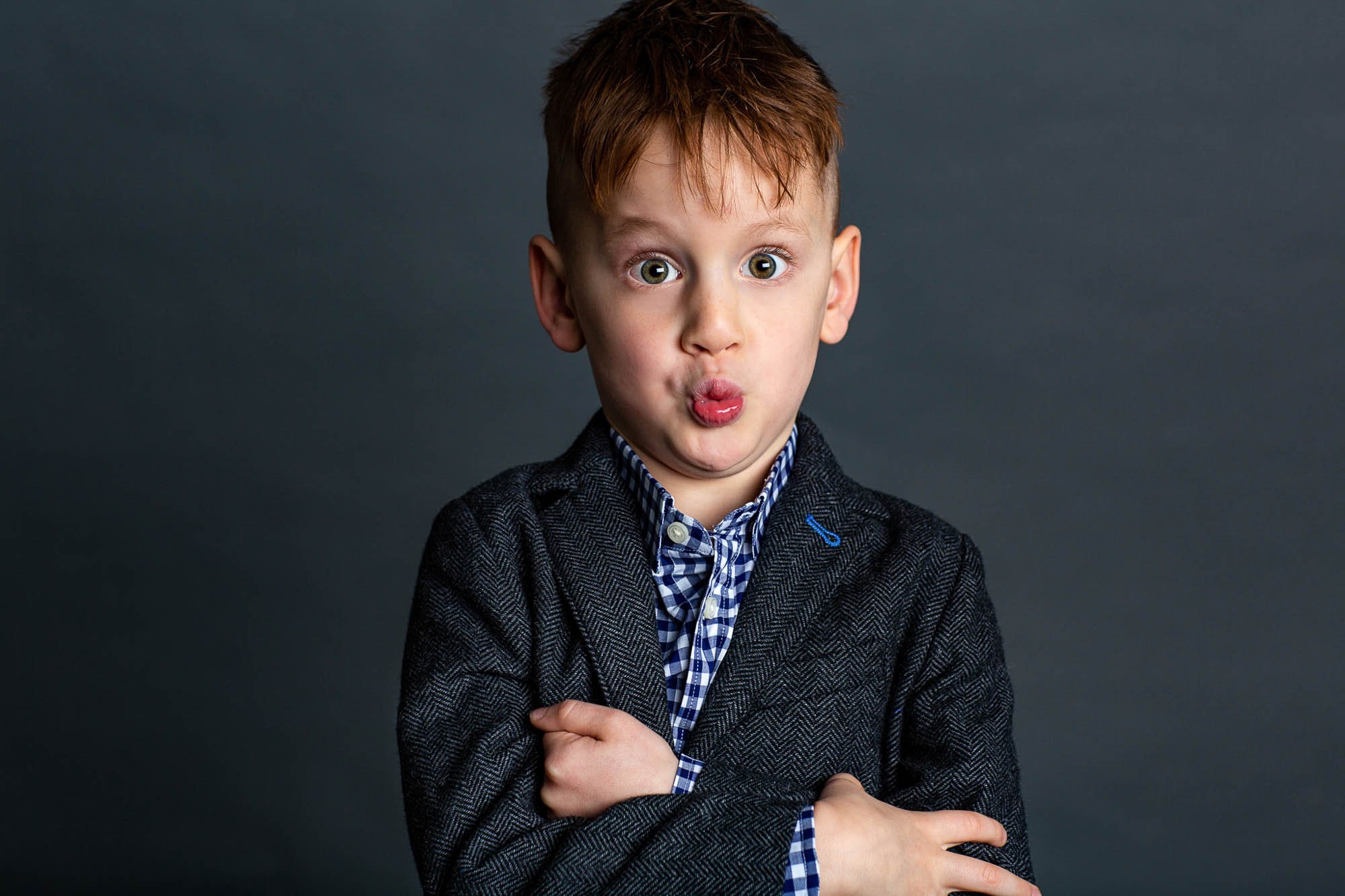 Smallish-Seattle-family-photography-studio-child-funny-face-portrait.jpg