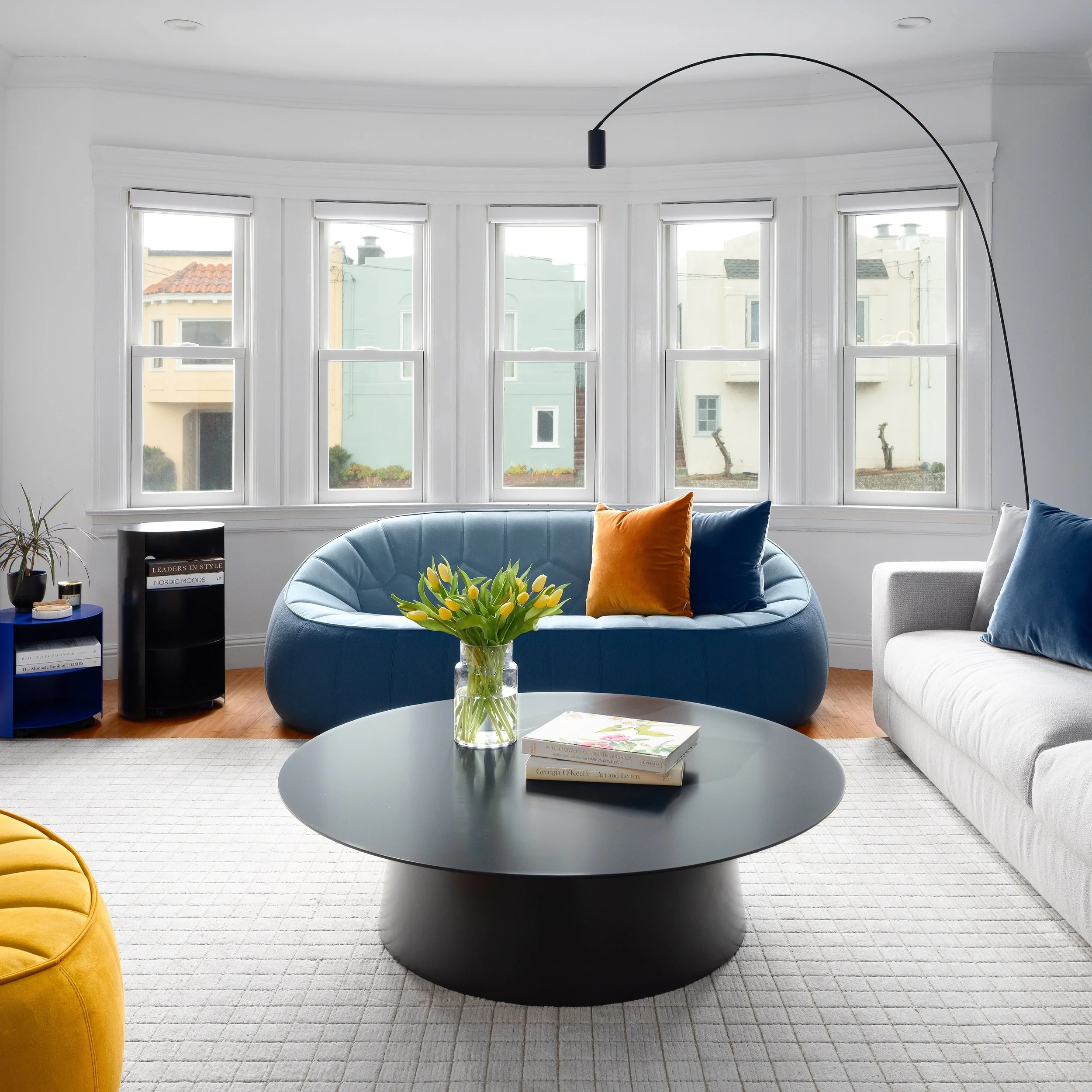 Bold color, sculptural forms, and a family home designed to feel playful, modern, and deeply personal.

For this San Francisco Sunset District project, we layered fast-delivery furnishings with curated statement pieces, textured finishes, and strong 