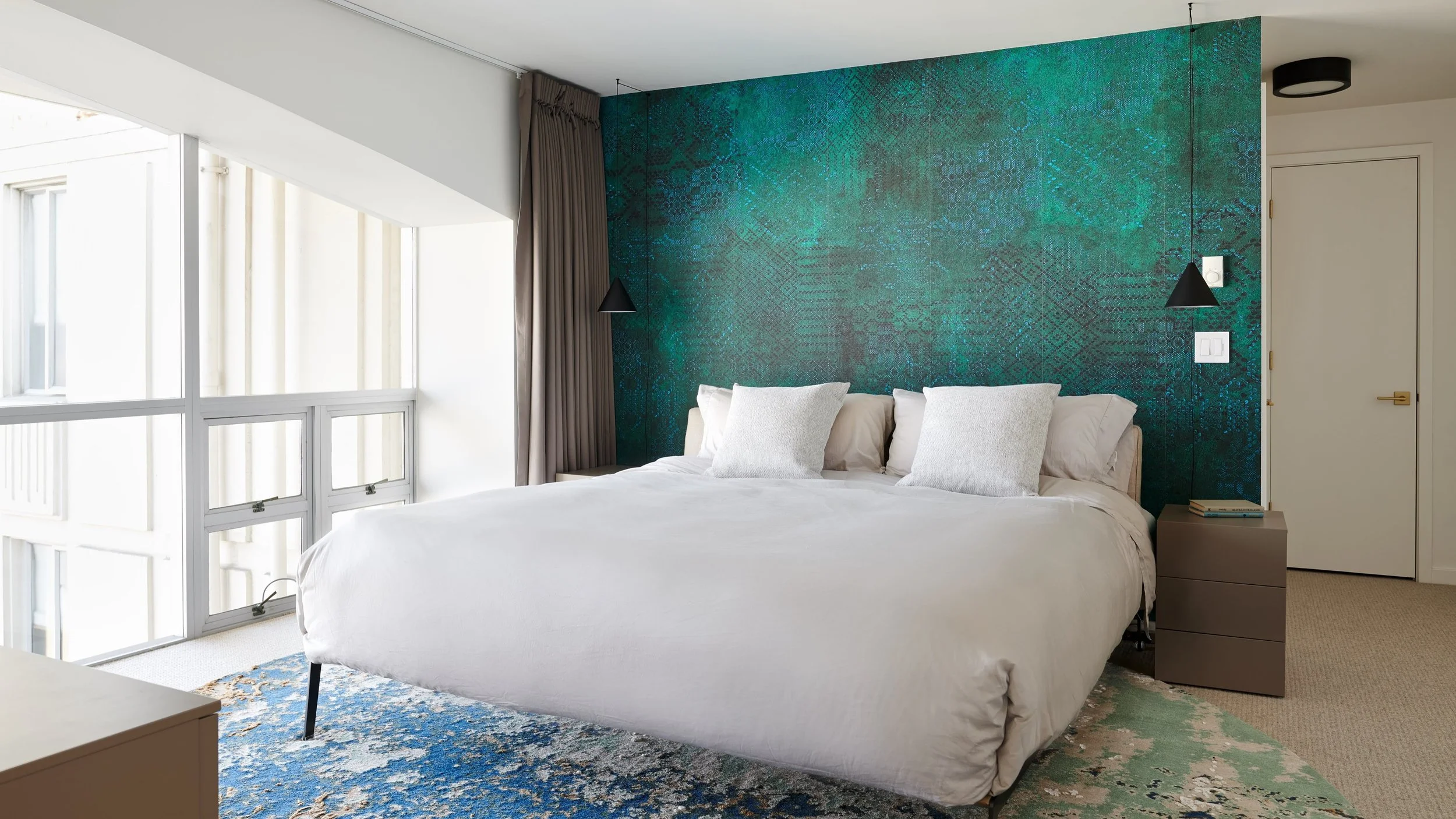 Wallpaper has a way of transforming a room like almost nothing else.

I love how it adds depth, texture, and personality, whether it's a quiet linen texture, a handcrafted mural, or a bold botanical pattern. It can make a small powder room unforgetta