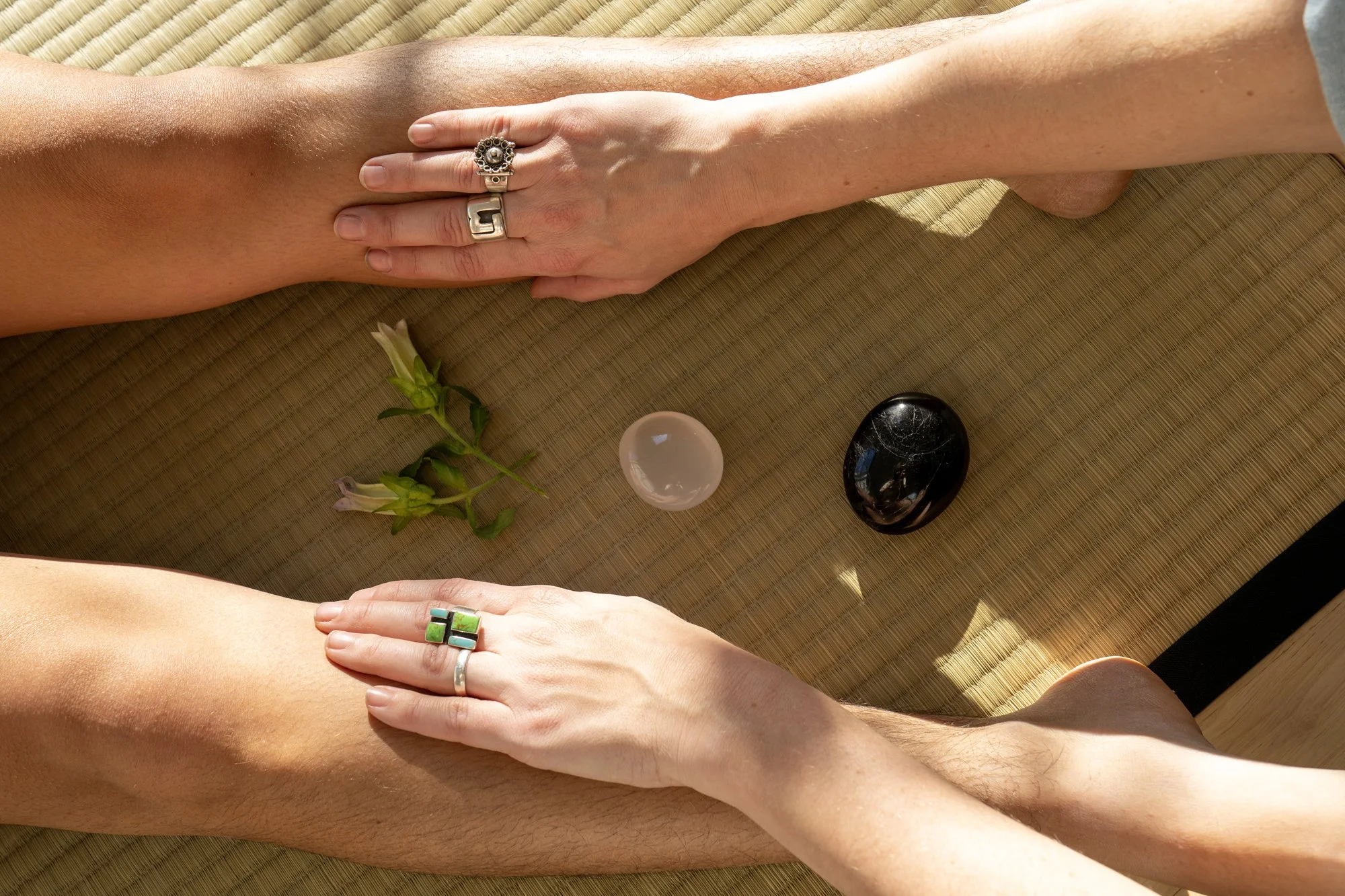 A photo of Louise's hands while working with a client during a Reiki session.