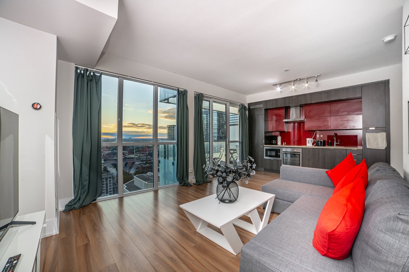 Open-plan Toronto condo interior with large windows