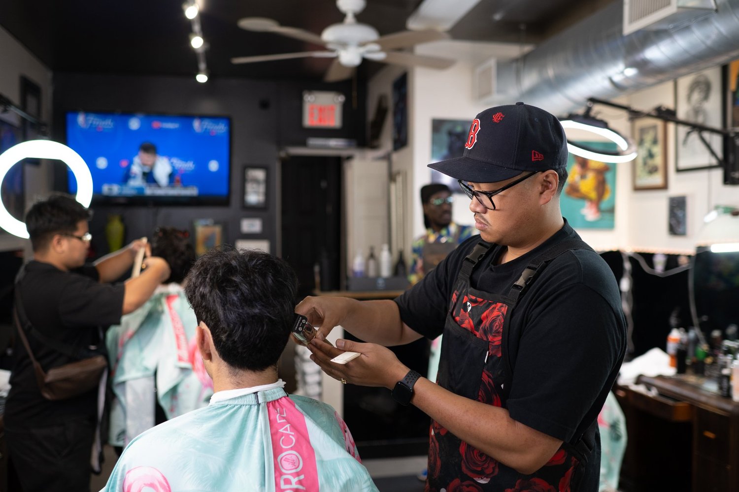 Barber working with a client during a Toronto business branding photoshoot