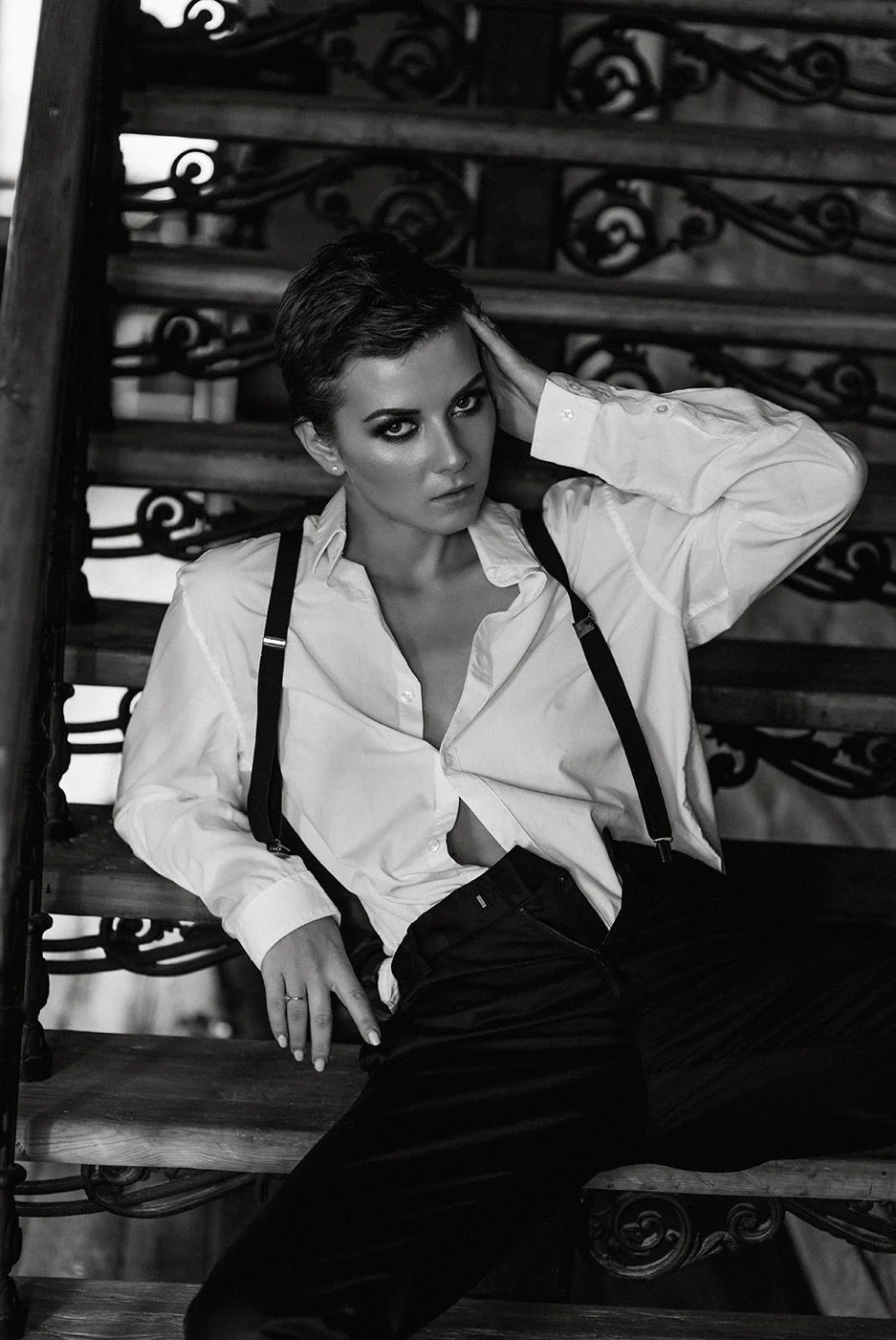 Monochrome editorial portrait on a heritage staircase