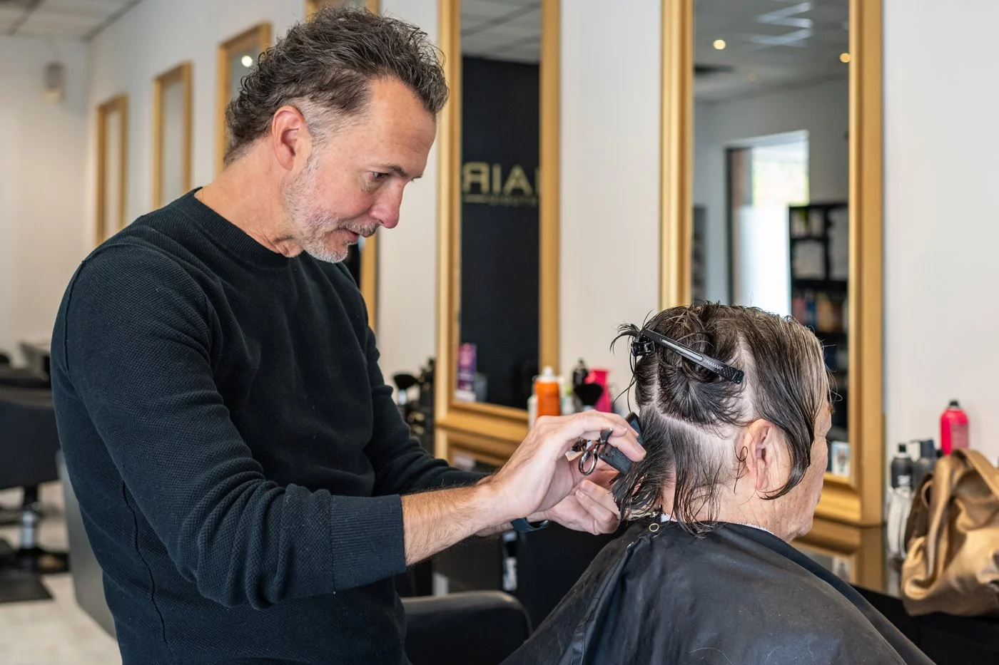 Hairstylist at work during a Toronto business branding photoshoot