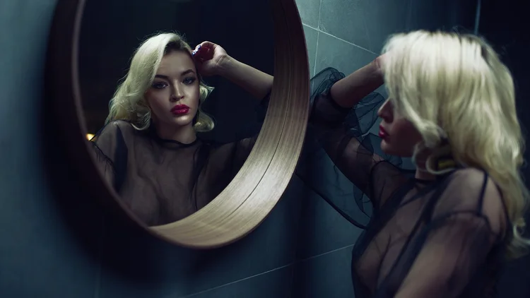 Boudoir portrait reflected in a round mirror