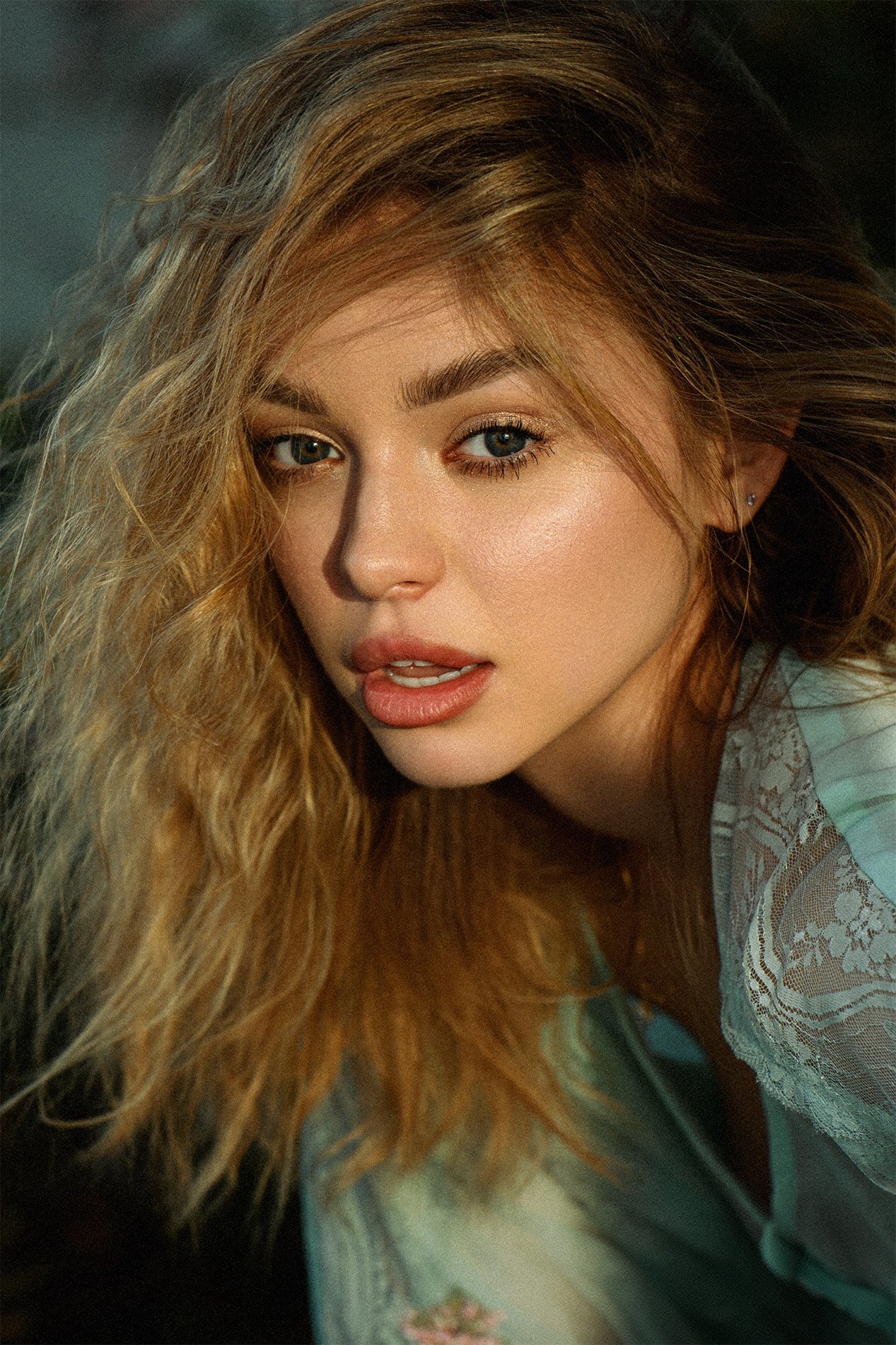 Natural light lifestyle portrait of a young woman with tousled hair and soft glam makeup, captured in a relaxed and intimate setting. This editorial-style image showcases Dmitry Bugaenko’s signature cinematic look—perfect for personal branding, portr