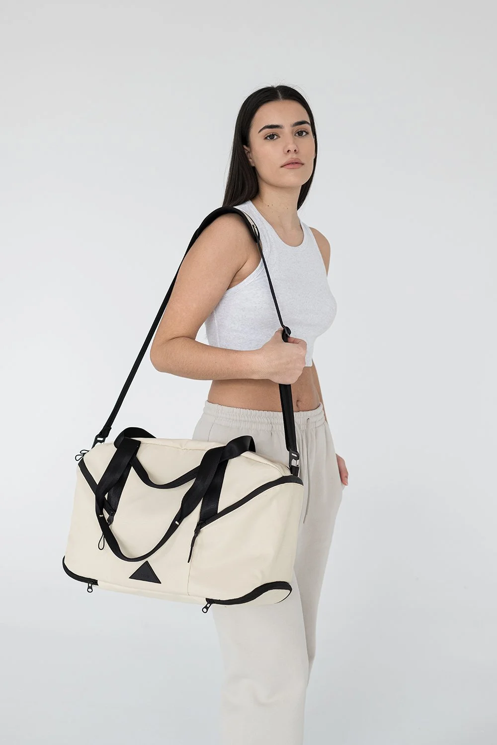 Model presenting a large travel bag for a Toronto commercial catalogue
