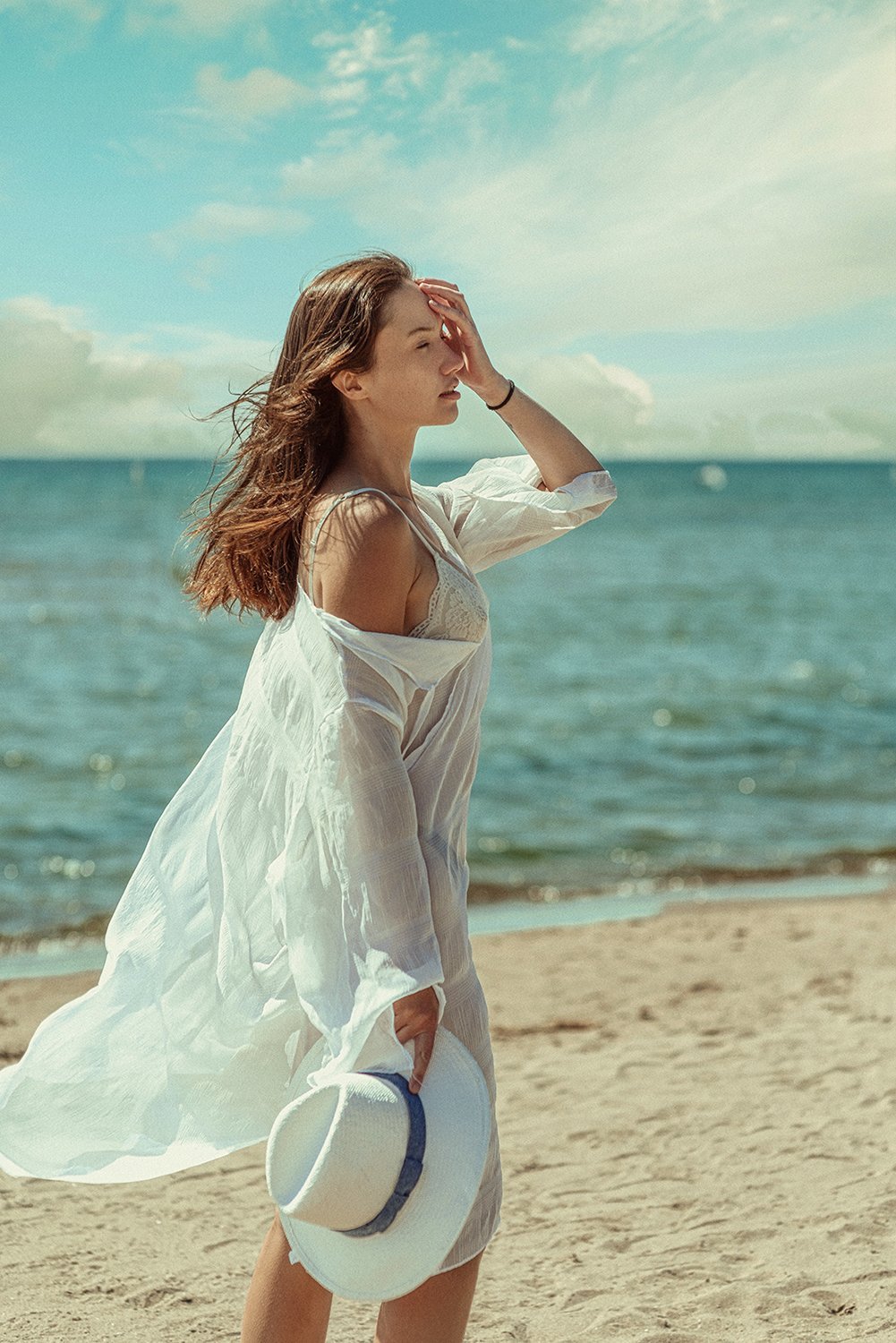 A flowing white dress on the beach