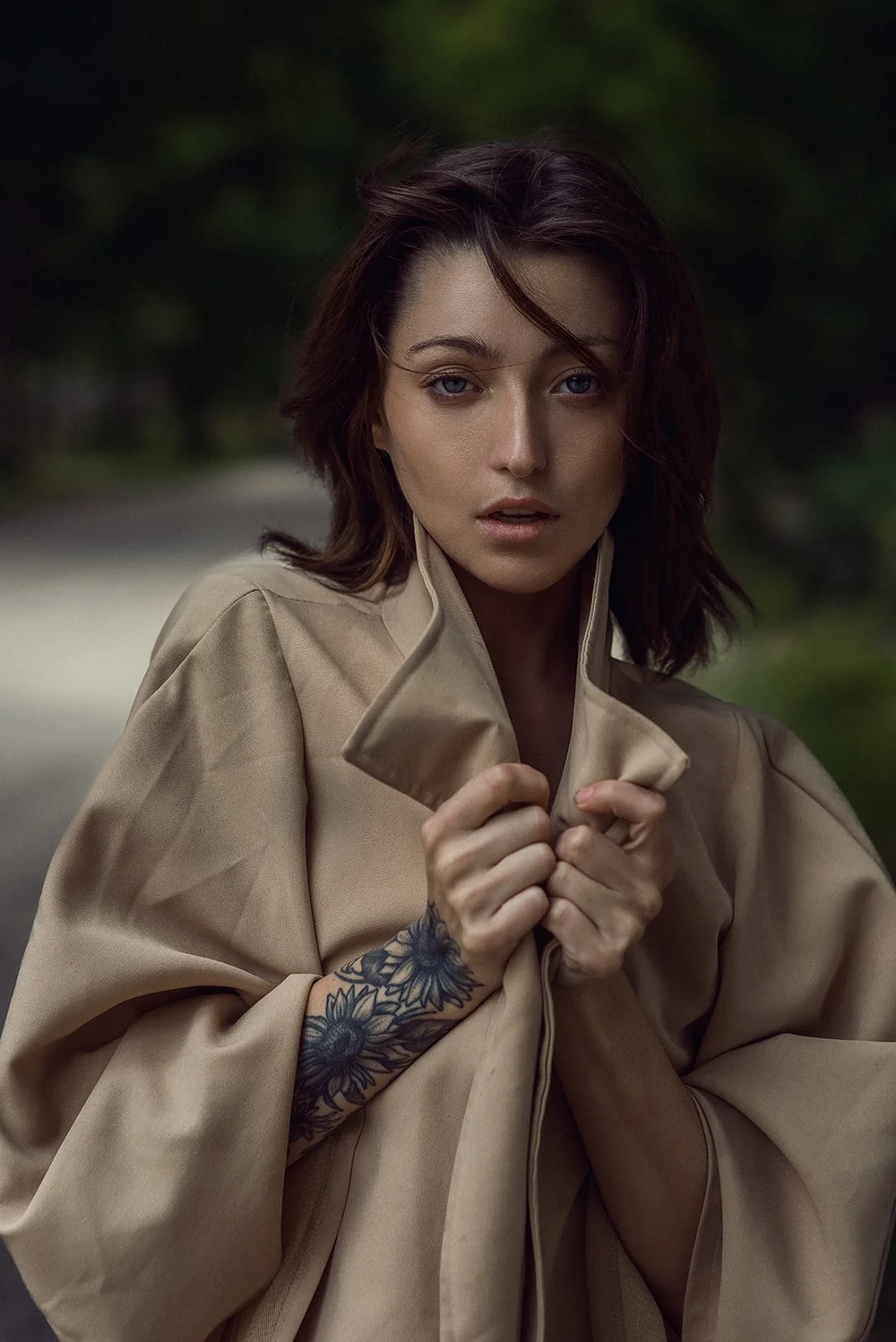 Close personal portrait wrapped in a beige coat