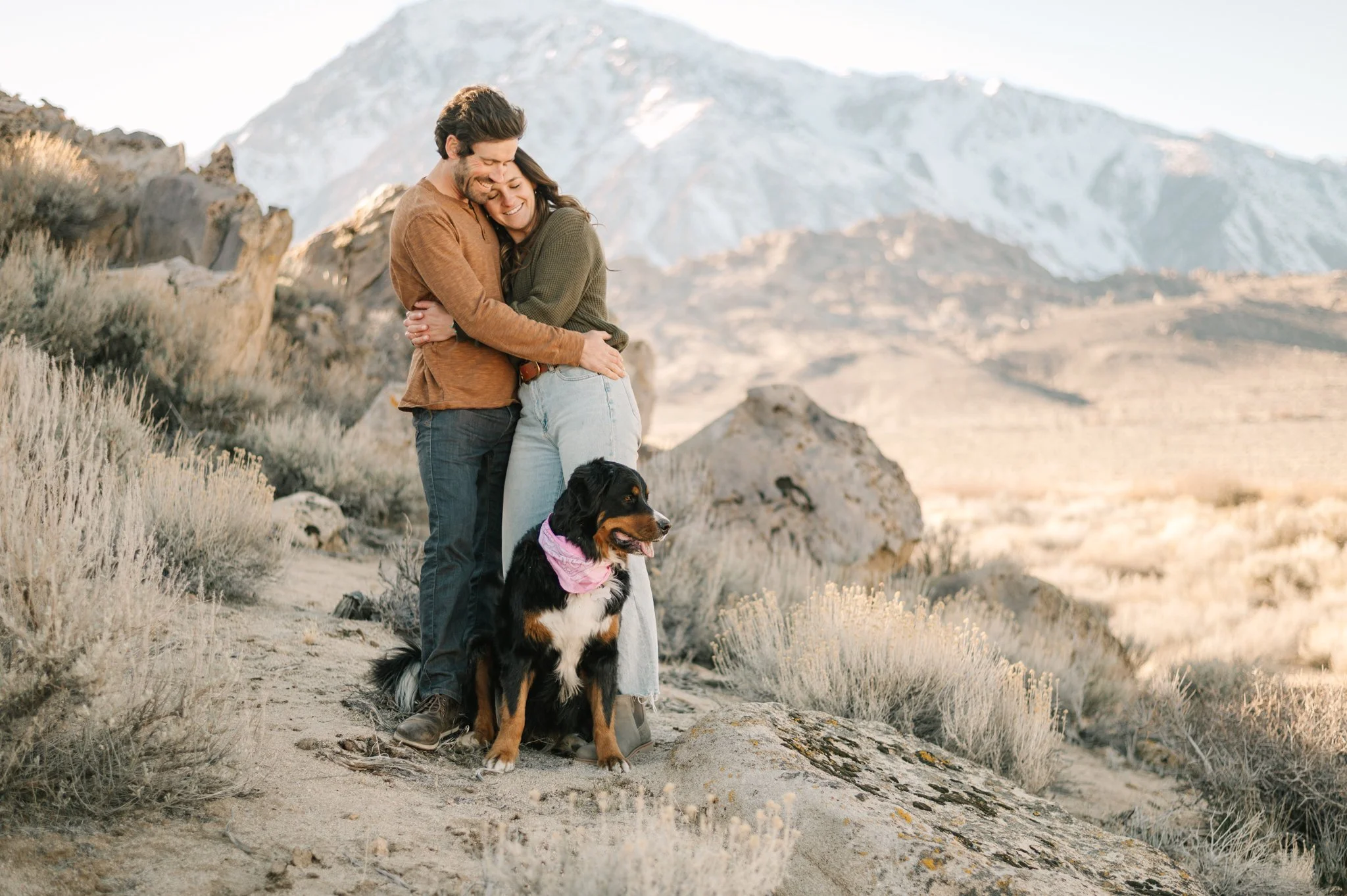 Bishop engagement of cute couple with their dog in front of an eastern sierra mountain range