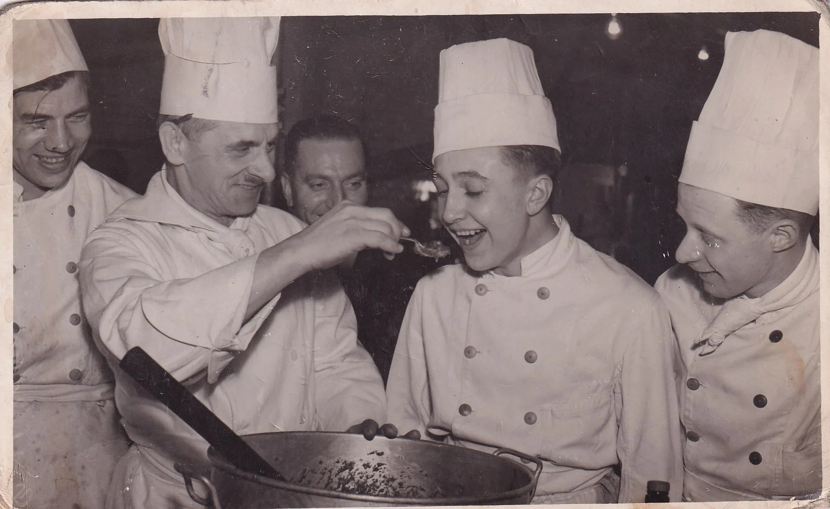 Chefs trying food, age unknown