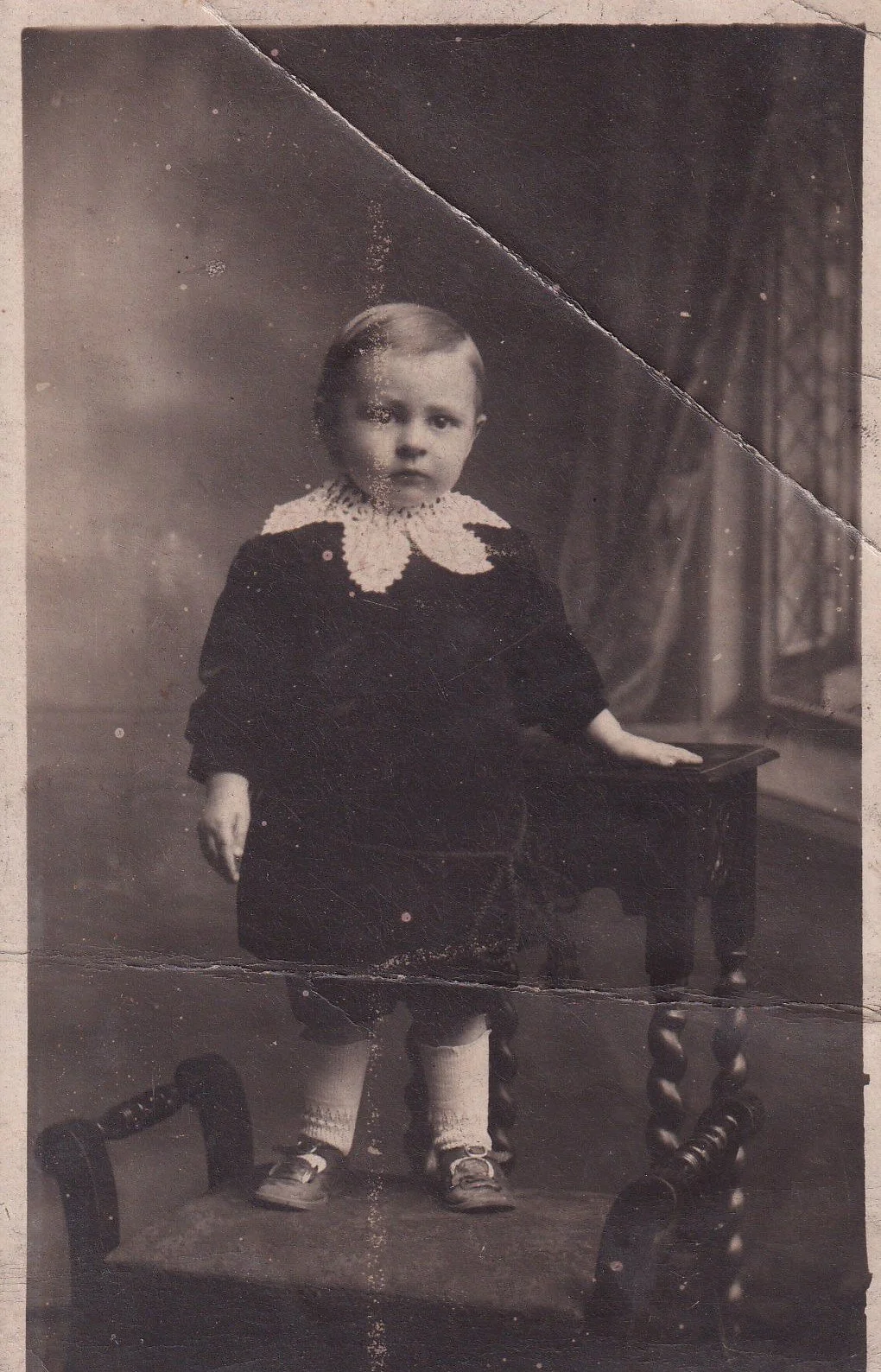 Child in crochet collar, early 20th Century.